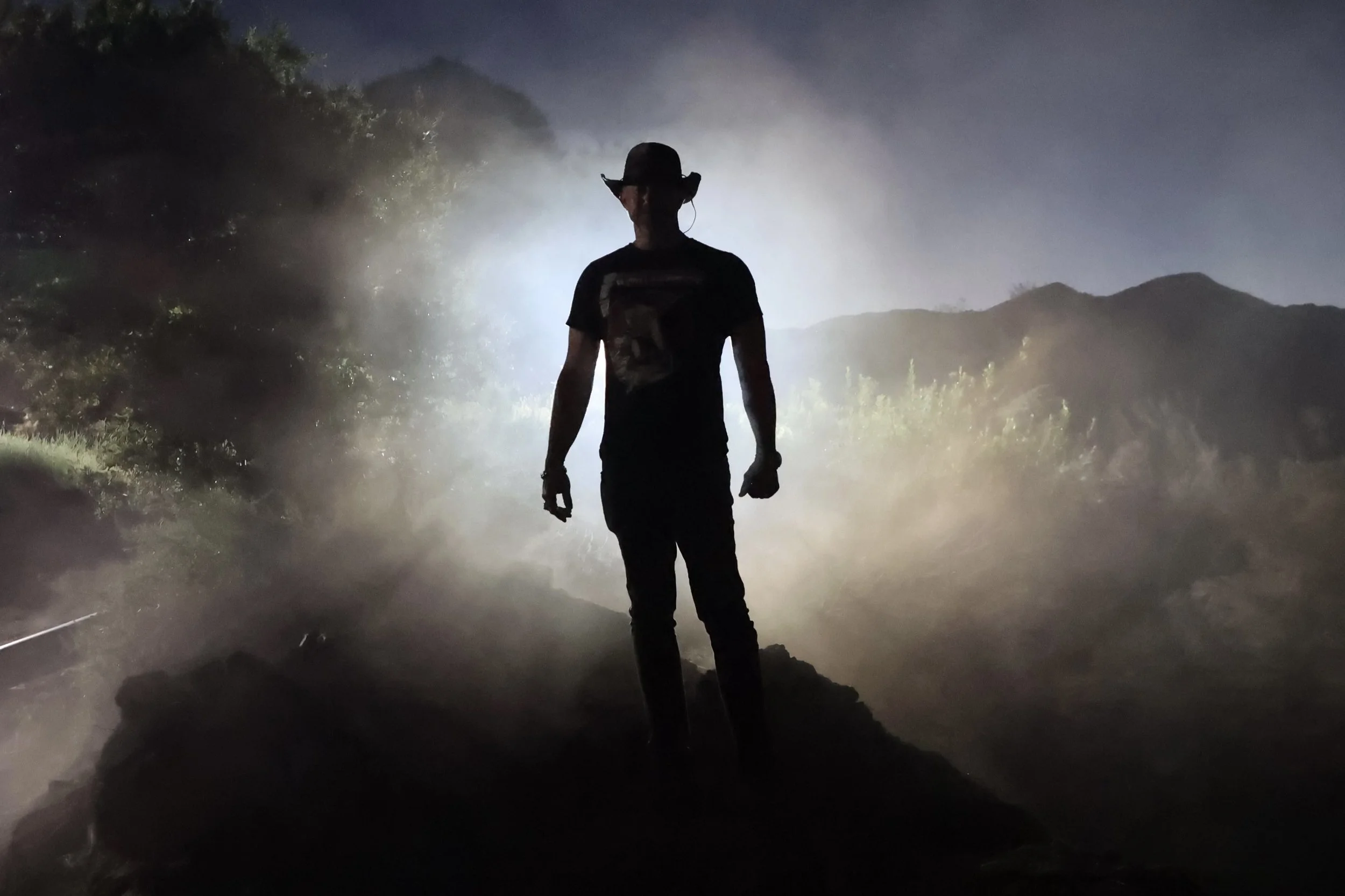 Jeff Wolfe directing on set during cinematic film production in outdoor mountain location