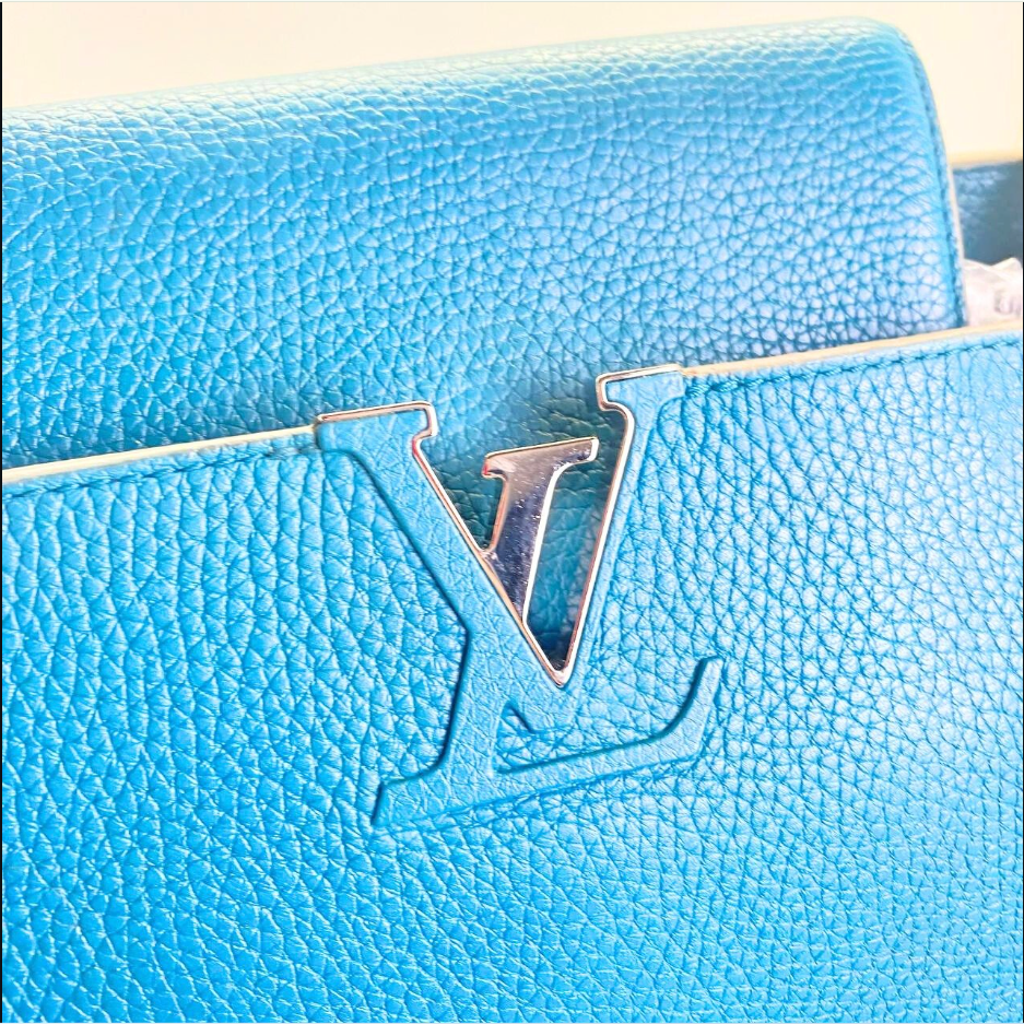 Louis Vuitton Capucines Logo.png