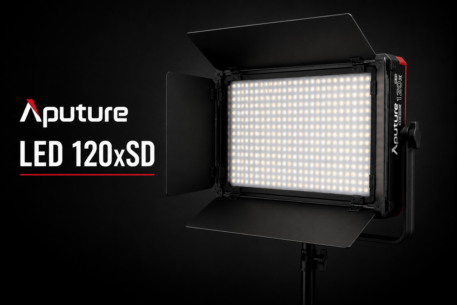 Aputure LED 120xSD studio light with barn doors and adjustable stand, illuminated against a black background.