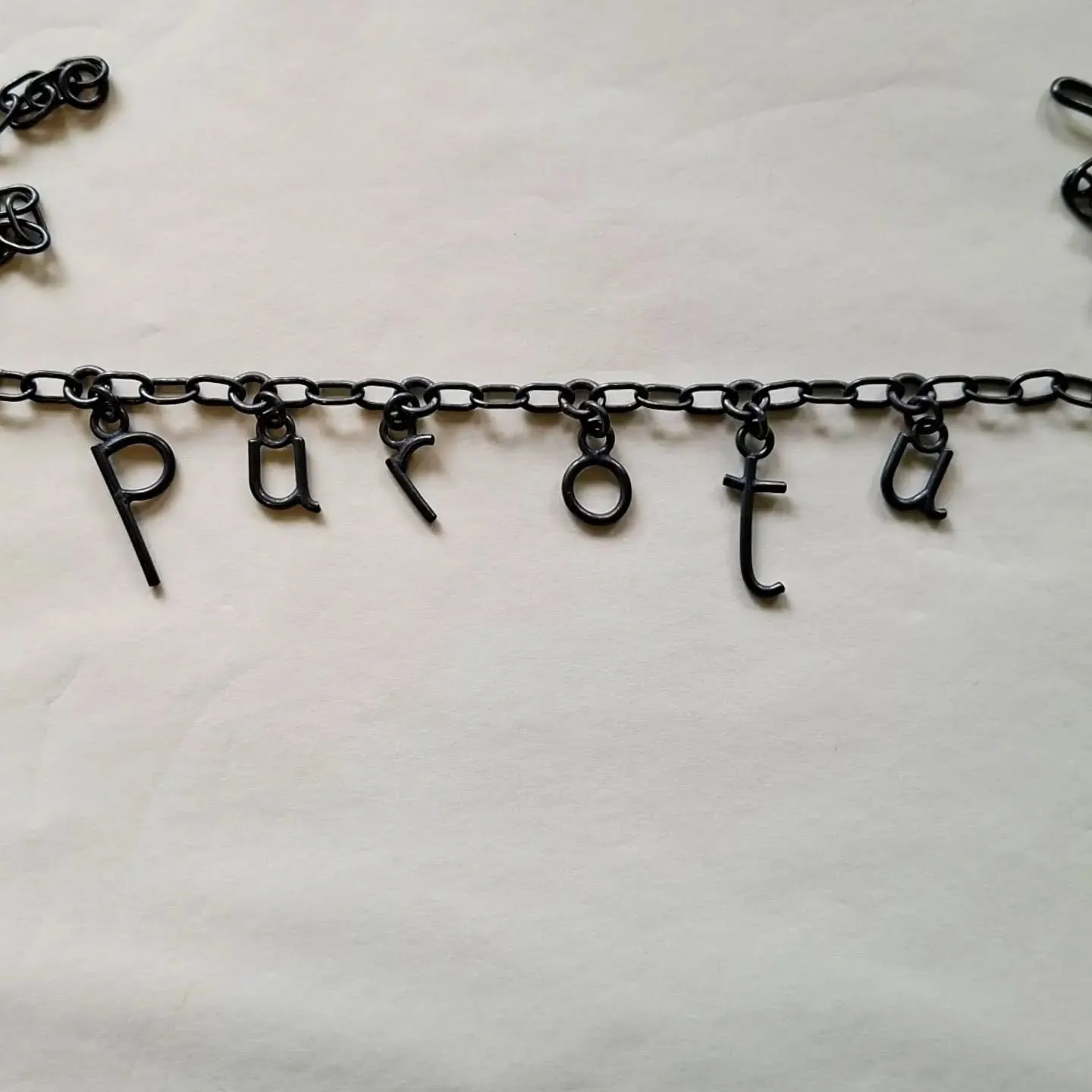 Porotu.
Oxidised sterling silver.
The first of a series of taonga whakarākei aroha (love jewellery). 
I tend to avoid using the word taonga as a direct translation for jewellery- because all jewellery isn't taonga. For me taonga has quite specific pa