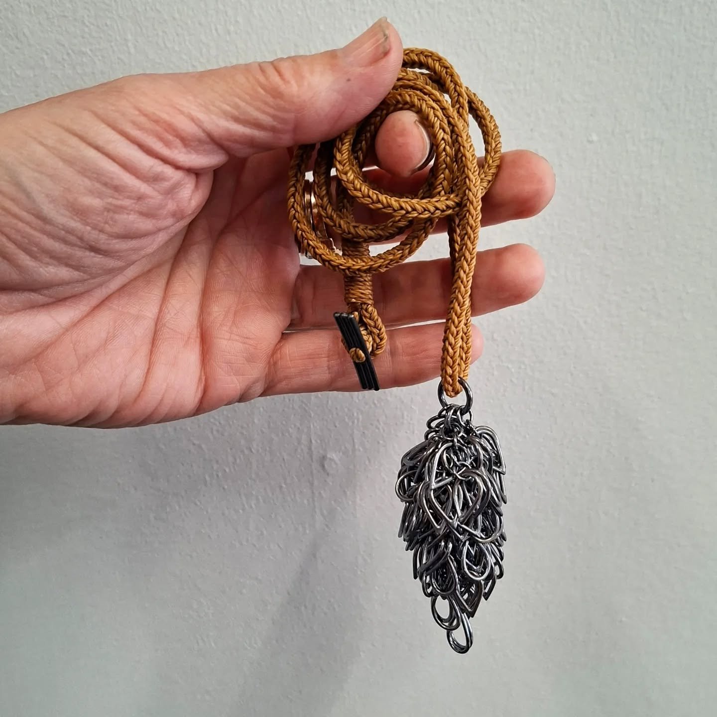 Little rain cloud pendant. 
Oxidised sterling silver. 

Made up of lots of little individual elements, assembled and soldered in to a single  tactile pendant. 

I'm not sure if I have a signature piece, (I don't really know what that means) but I do 