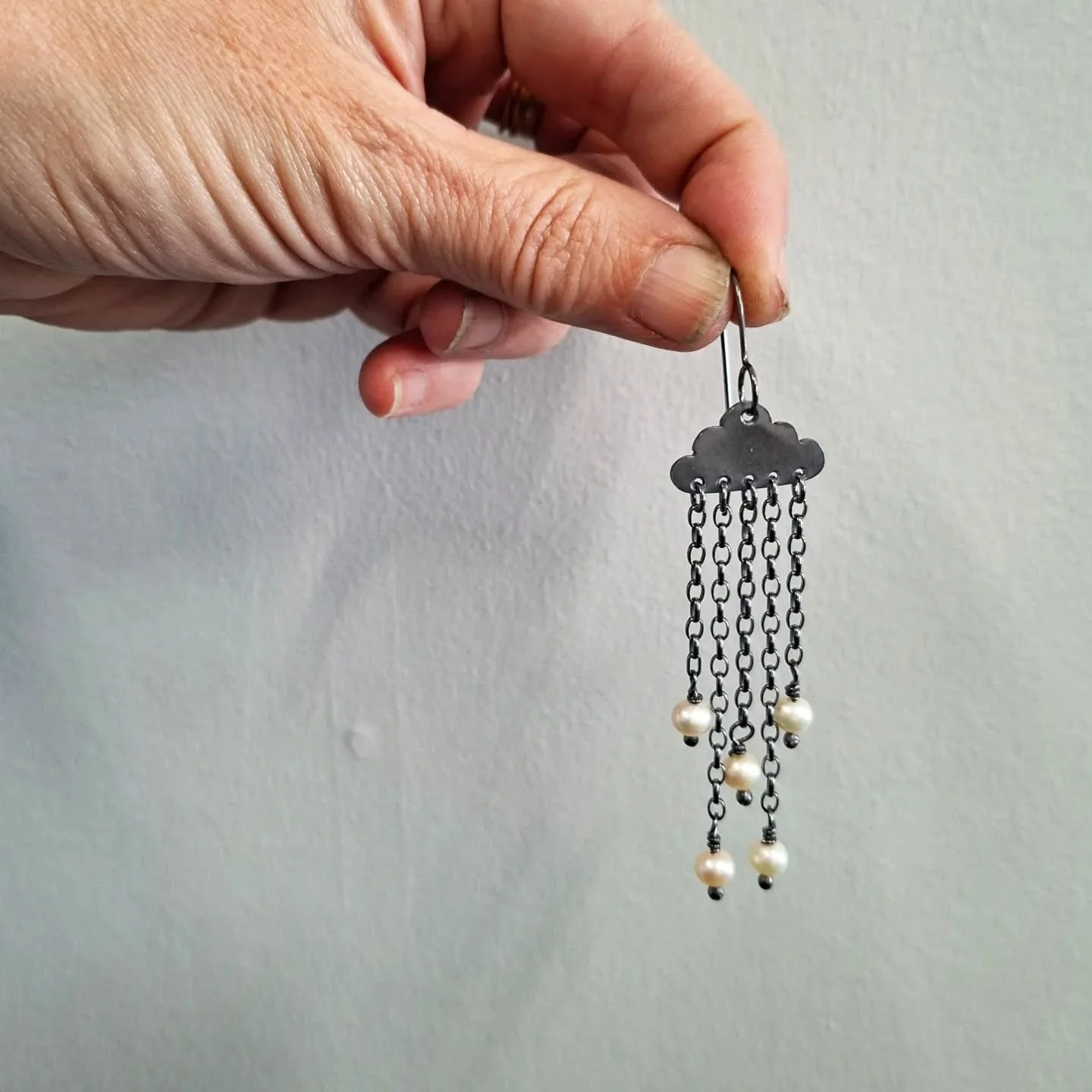 Ua.

Oxidised sterling silver, fresh water pearls. 
Little rain clouds for your ears. 

I have a couple of pairs of these available via the workshop and website. 
I don't think I will get time to make more before the end of this year, so if you want 