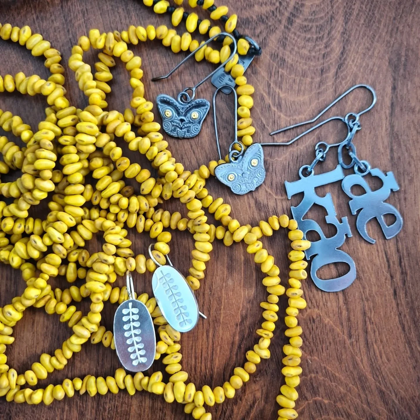 Kākano kōwhai necklace, with earrings.