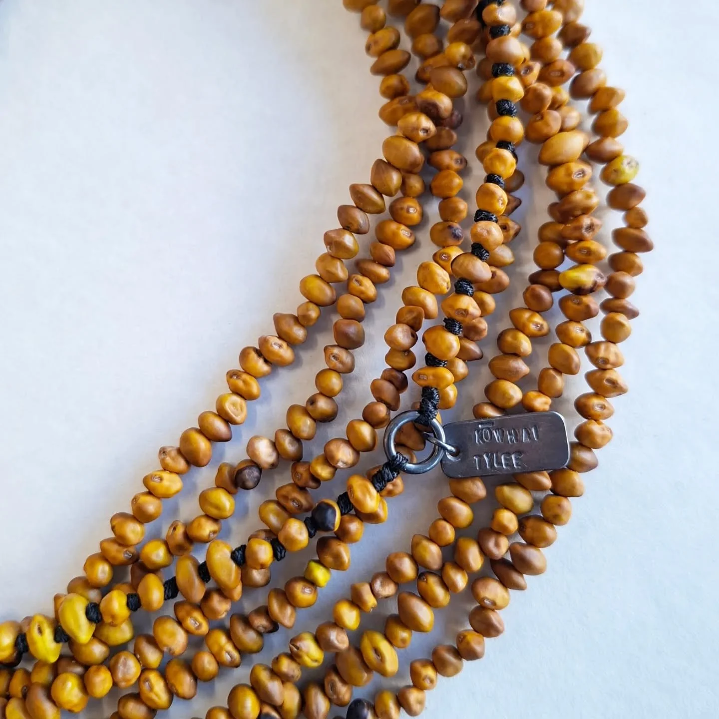 Kākano kōwhai, Tylee cottage, Whanganui. 

Kōwhai seeds, collected, podded, stored, drilled, threaded, sterling silver tag, polyester cord.
330 cms, total length.

These are the last of the Kōwhai seeds from a batch I collected a few years ago when @