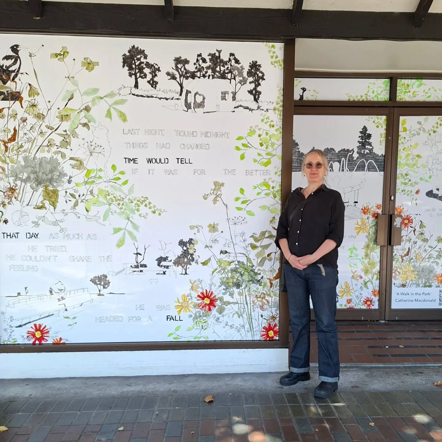 The Macdonald had a drawing put up on Victoria Ave today, (just down from the corner of Victoria and Guyton street) so I demanded that she pose in front of it so I could take photos. 
There are lots of delightful little details to spot in the window-