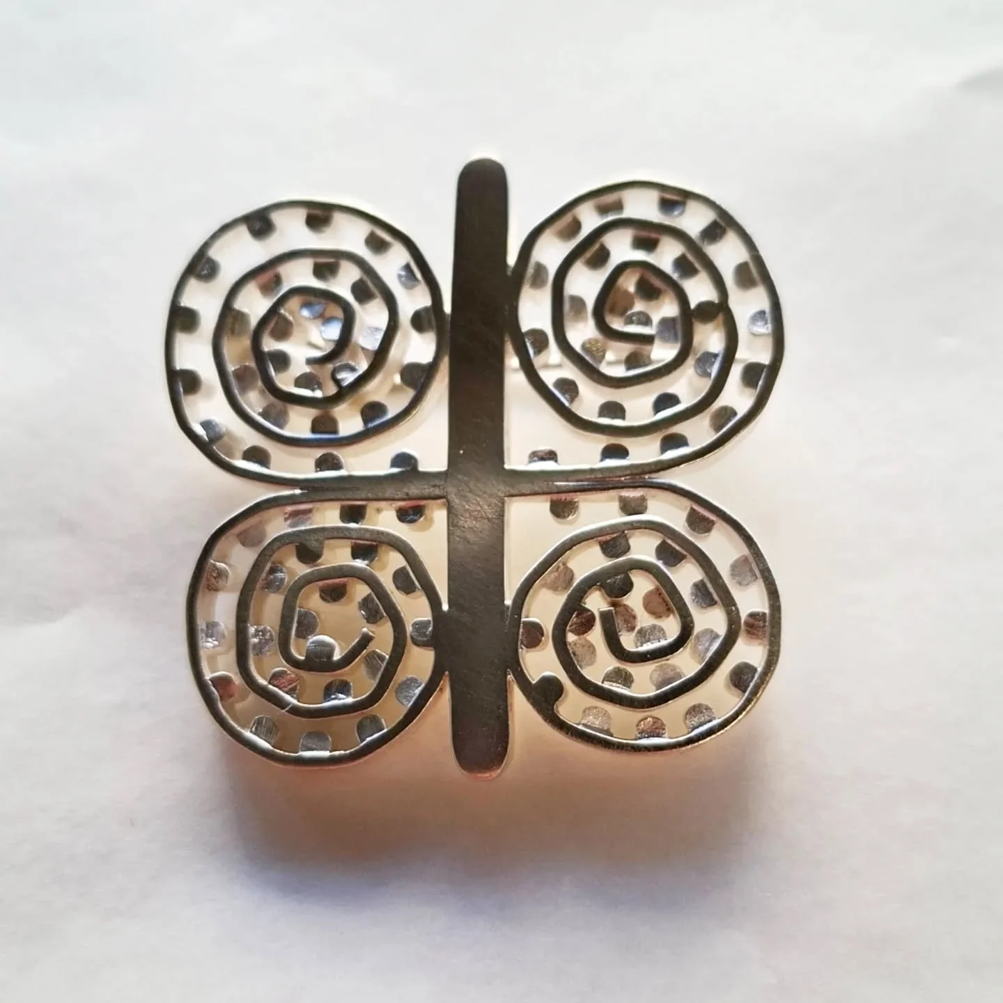 Pūrerehua 
2026

Sterling silver with stainless steel pin. 
Hand fabricated from wire. Cut, sawn and soldered together using an unholy amount of solder.
