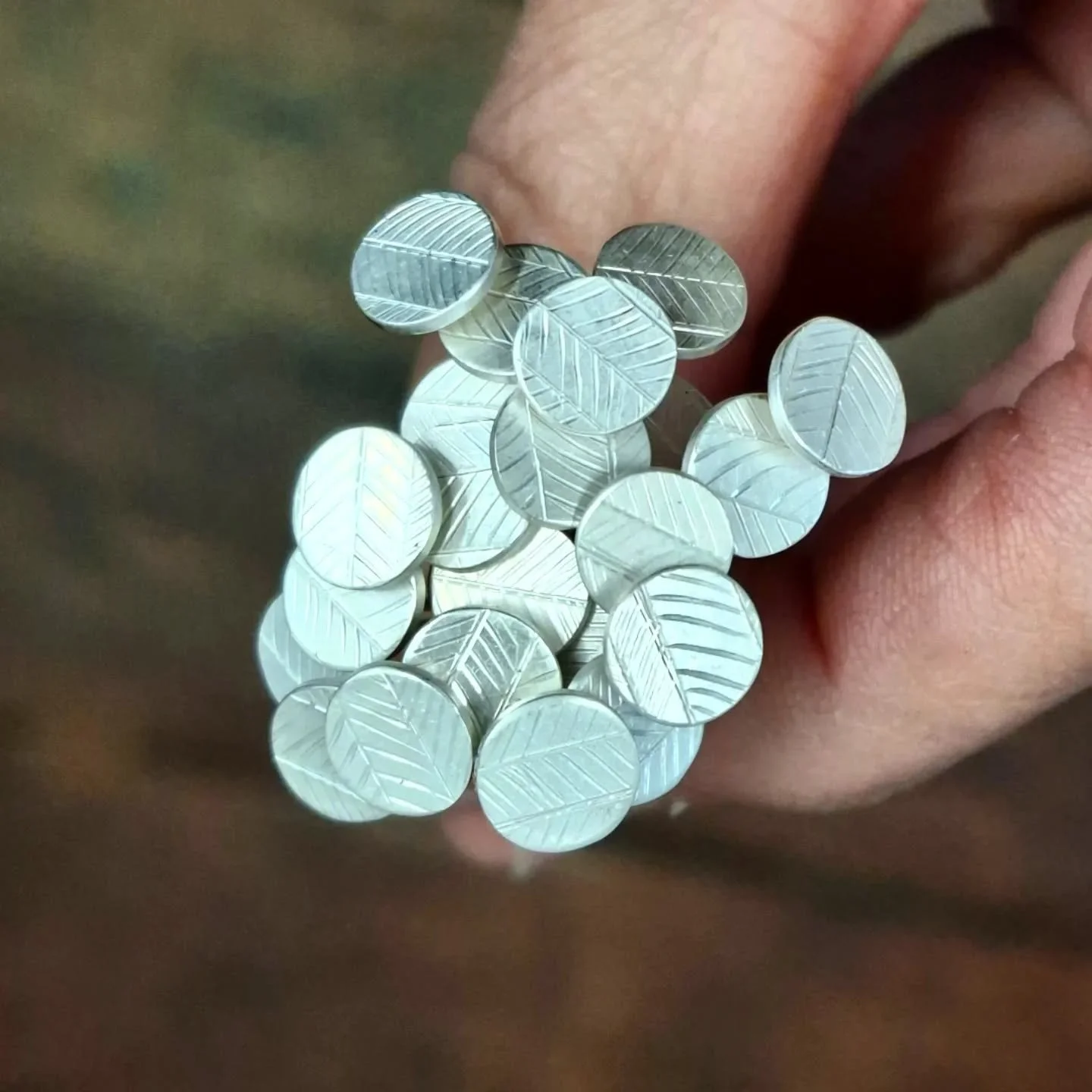 Components. 
These will grow up to be part of an earring design I am working on. 
I do love a little component, especially in multiple. 
For these ones I have engraved a sheet of sterling and cut circles which are filed, sanded and then soldered on t