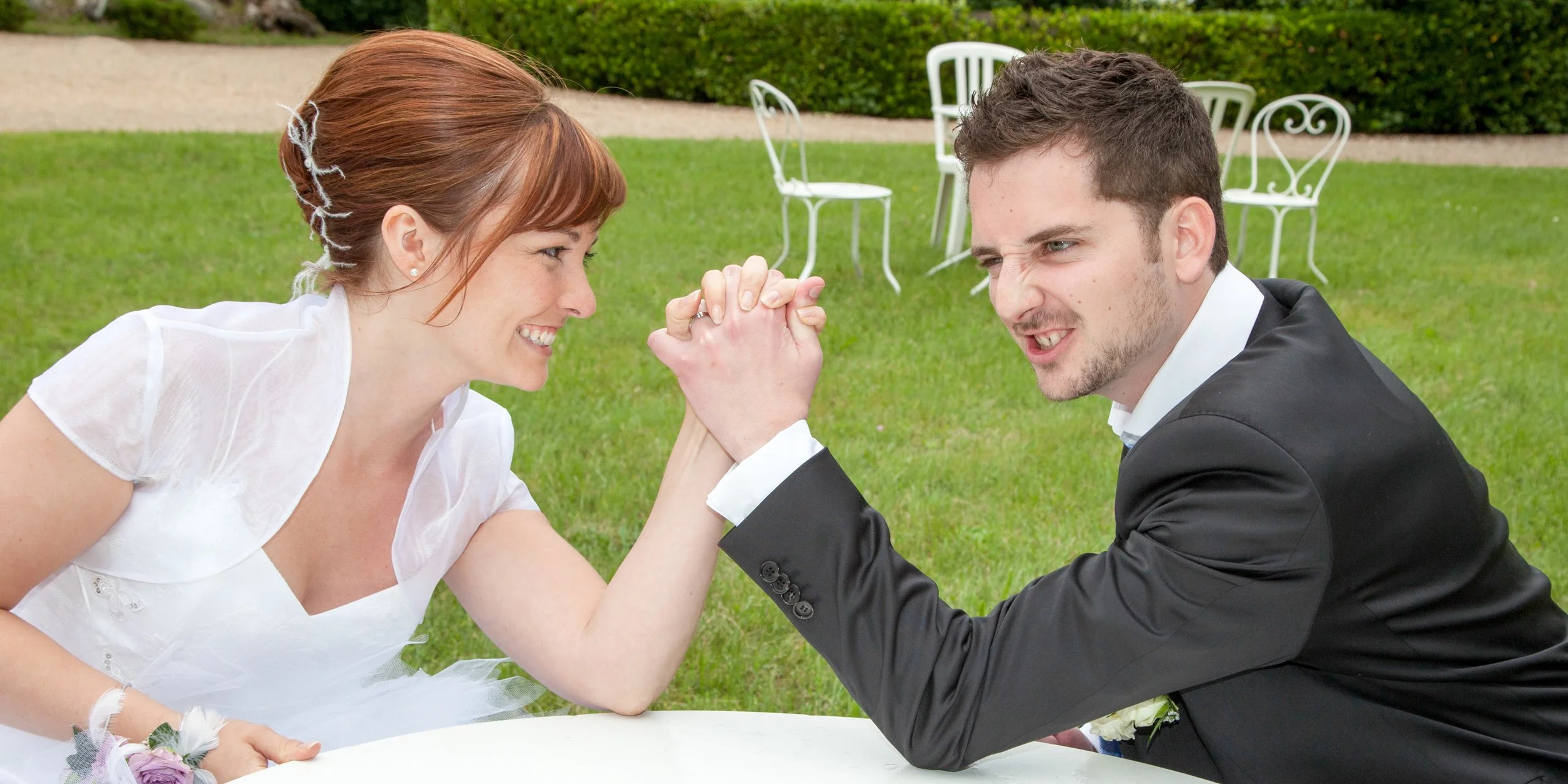 Husband and Wife Arm Wrestling