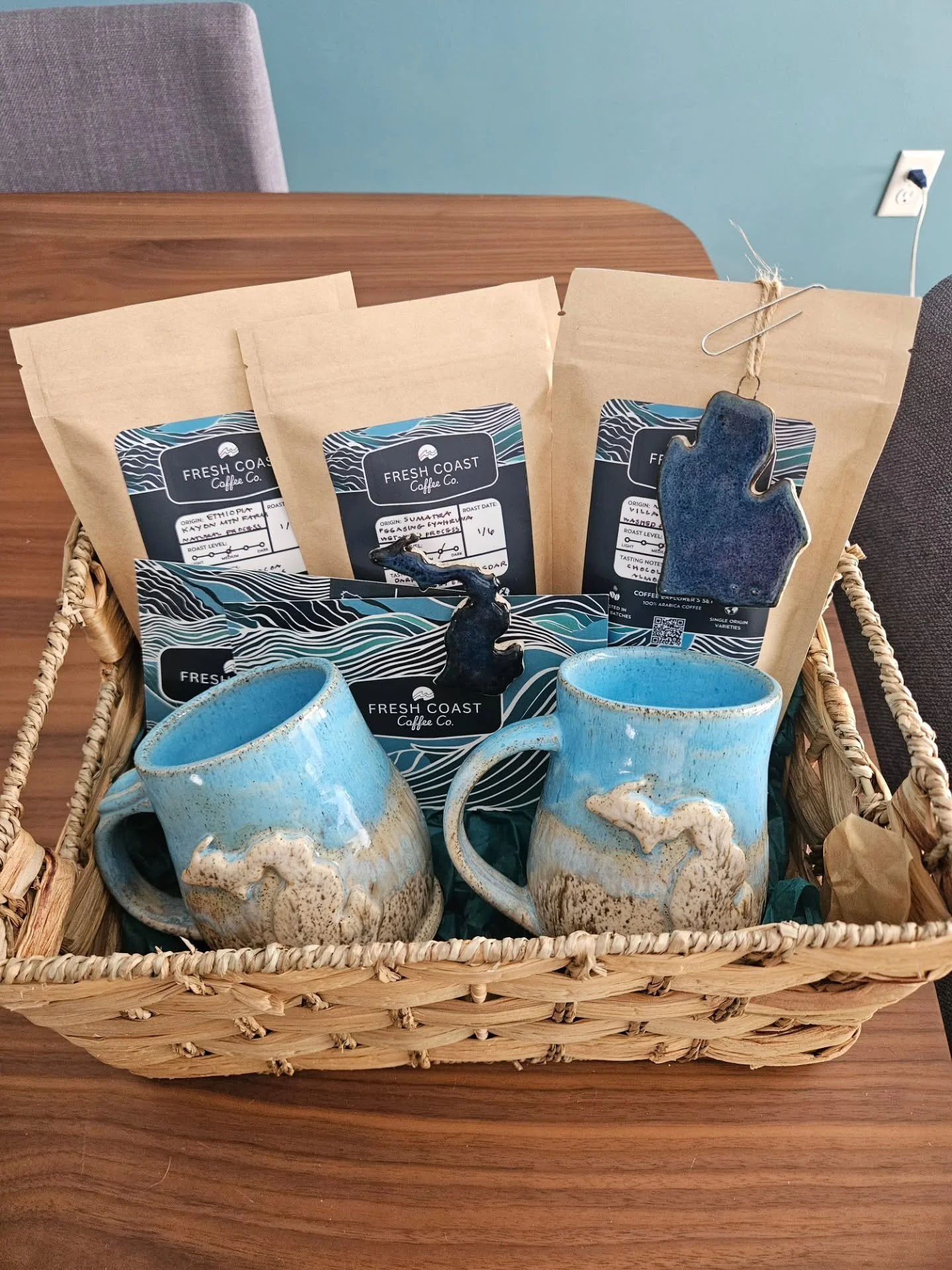Put together a basket for my friends at Ottawa Community Action Agency's Walk for Warmth fundraiser with Michigan mugs and @freshcoastcoffeeco #reddogclayworks #backyardpotter #communityaction