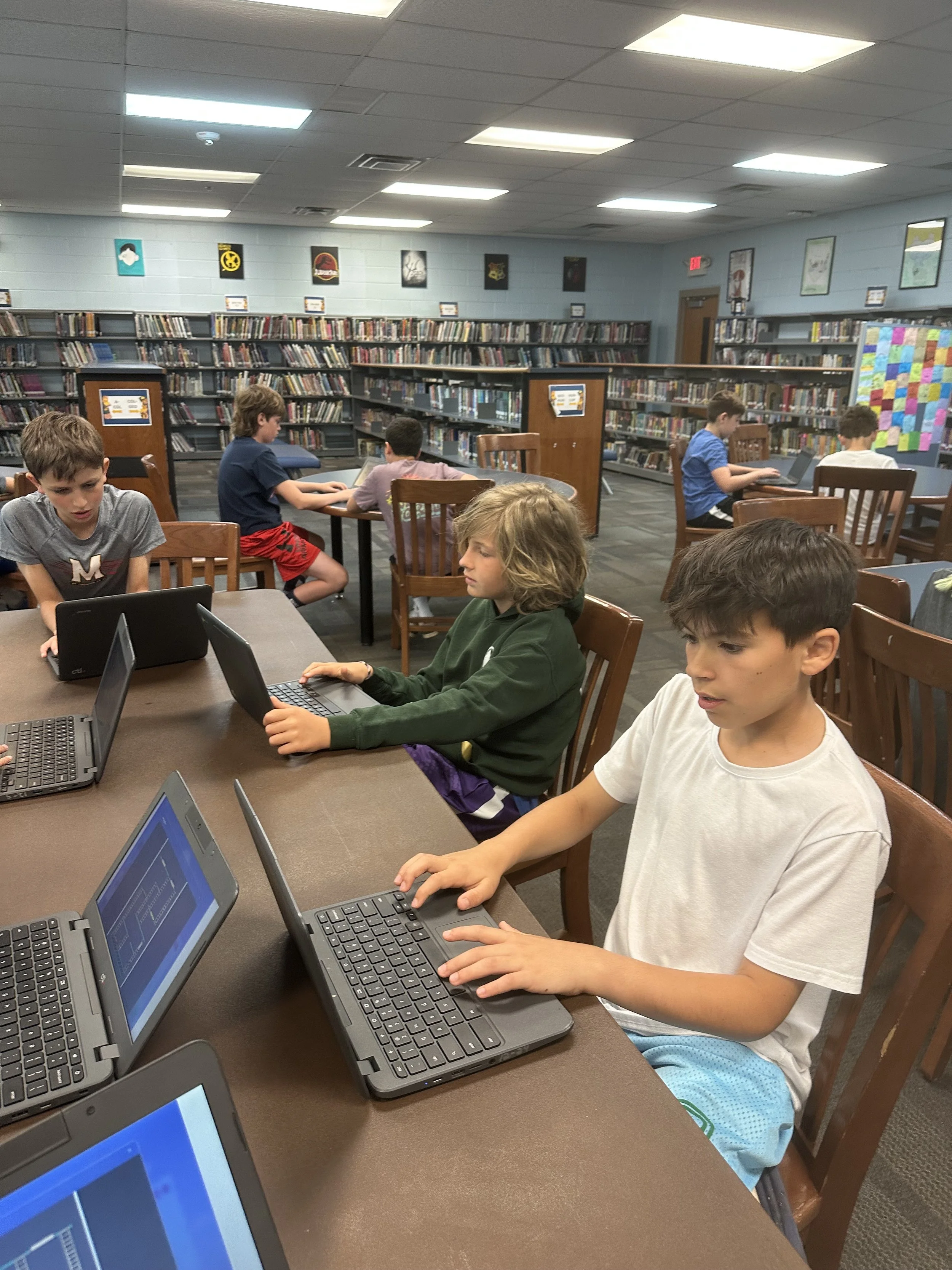 KNOLLWOOD-25-two-boys-crowded-over-laptop.jpeg