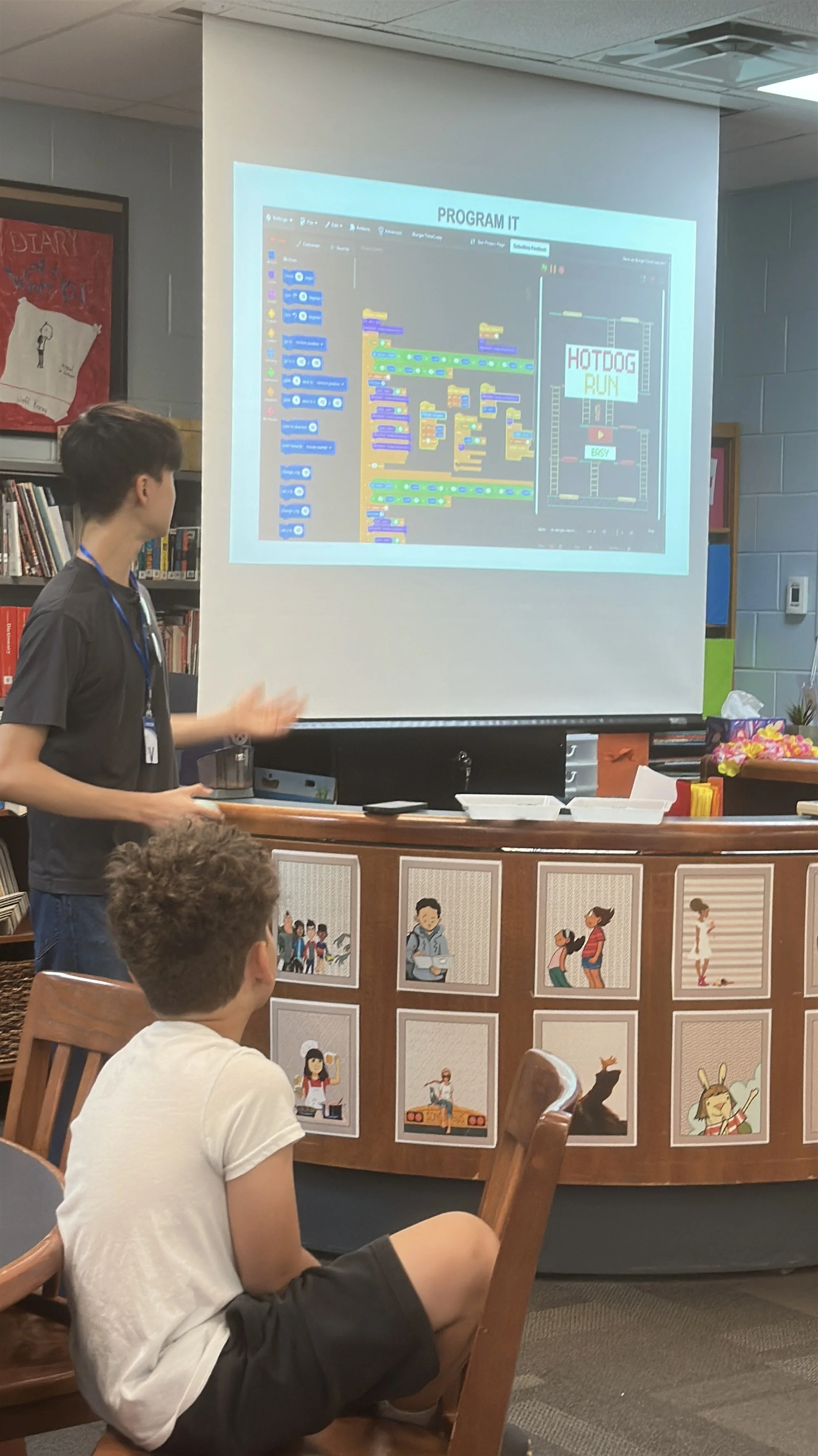KNOLLWOOD-22-truman-presenting-program-it-hotdog-run-slide.jpg