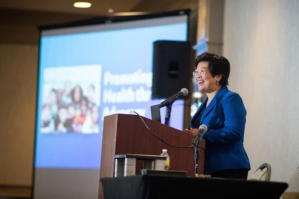 Dr. Sandy Chung speaking at a conference