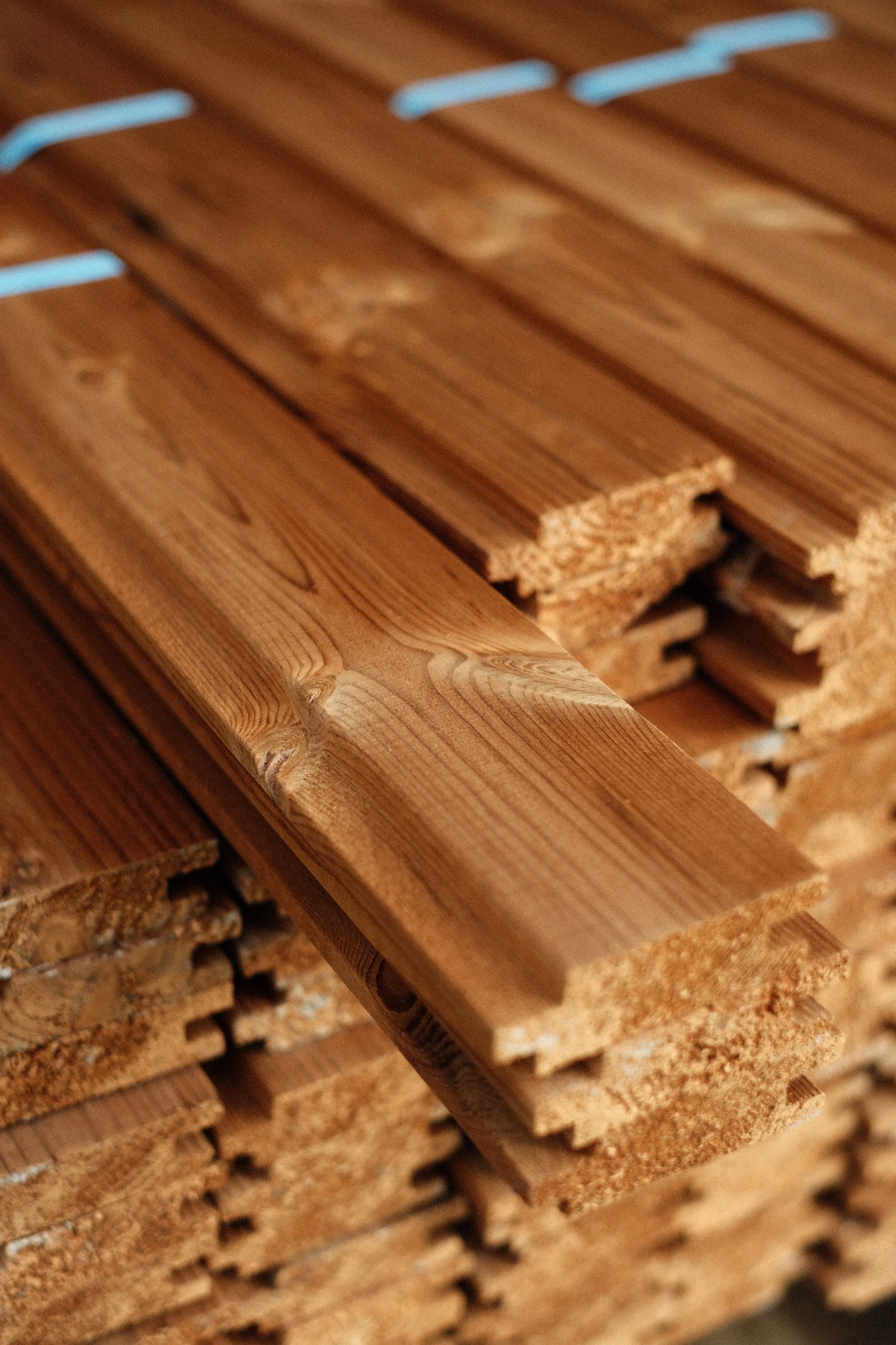 Close-up of stacked Lunawood ThermoWood Nordic Pine lumber.