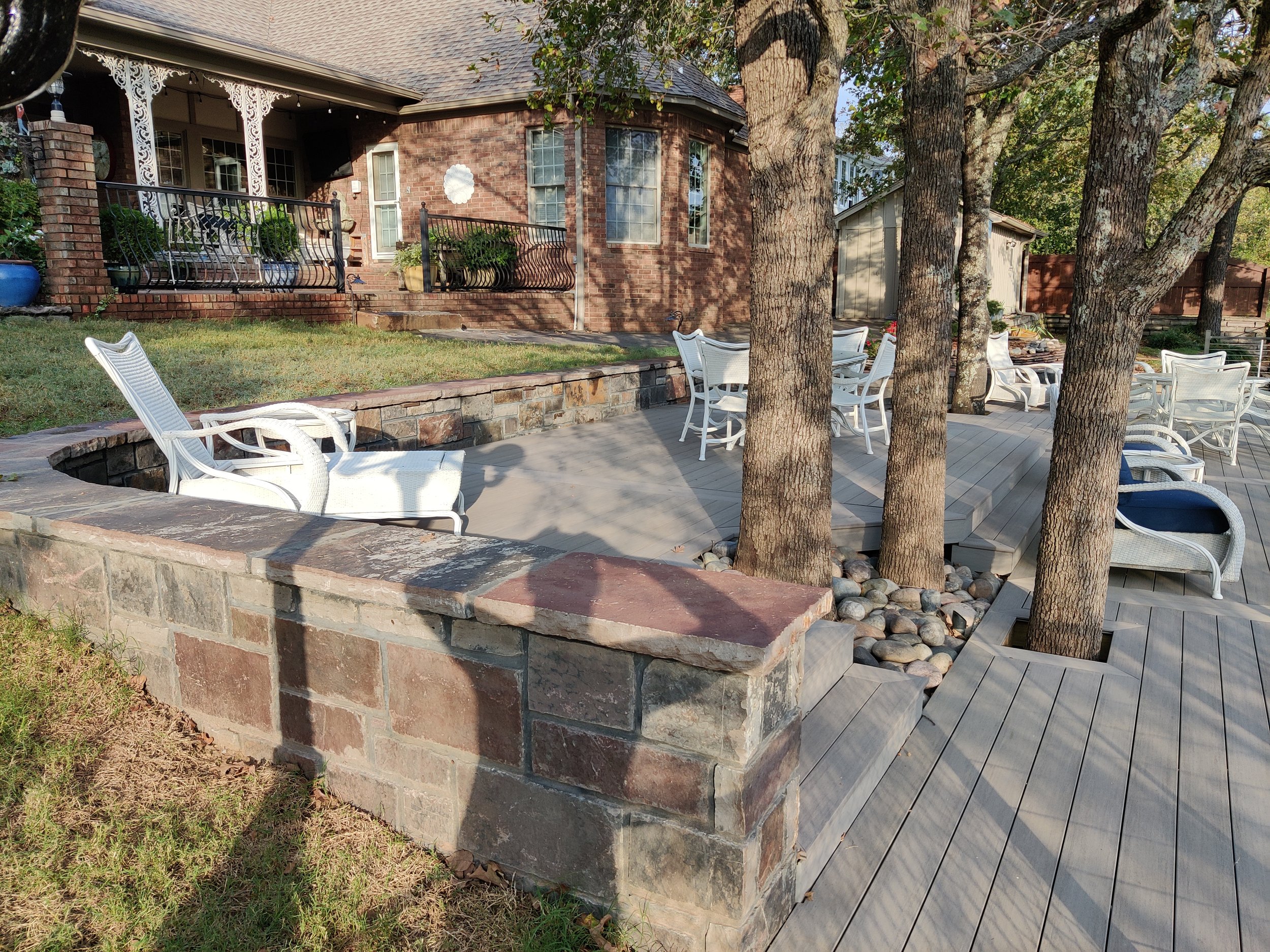 Rock Retaining wall, composite decking and cable railing
