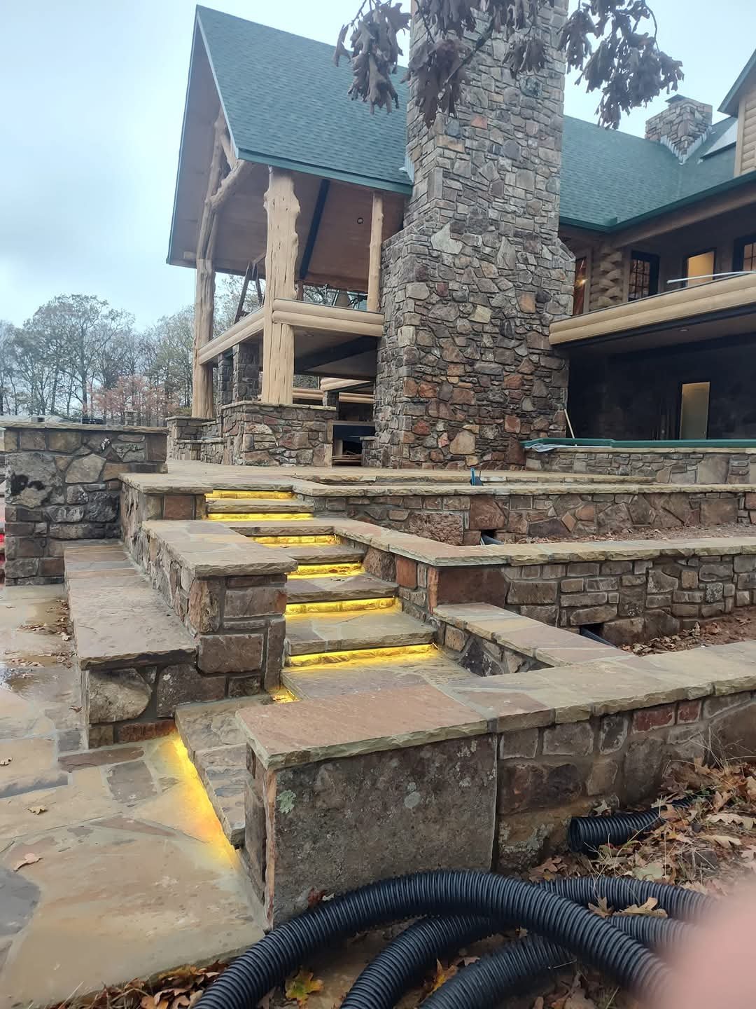 Rock work with custom stair lighting, rock benches