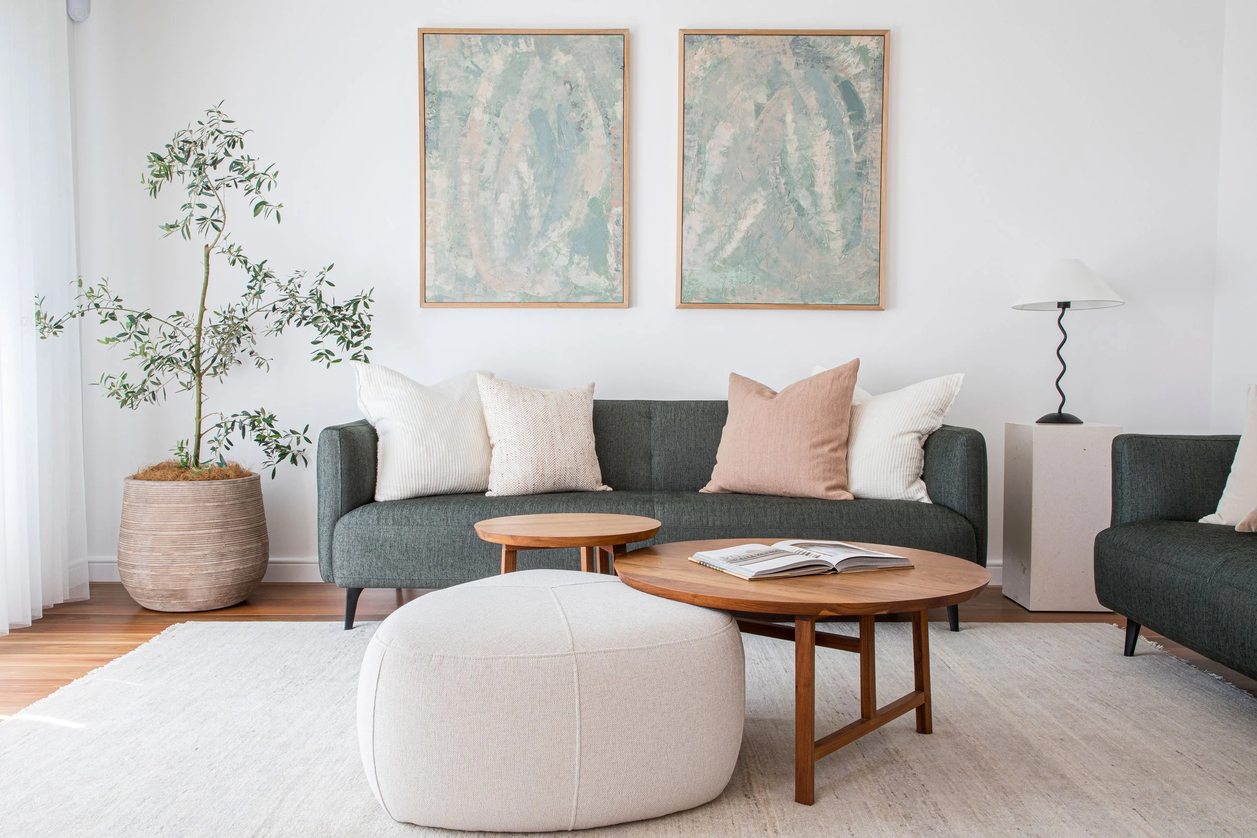 Sydney living space designer lounge below 2 wall art pieces Round Coffee tables