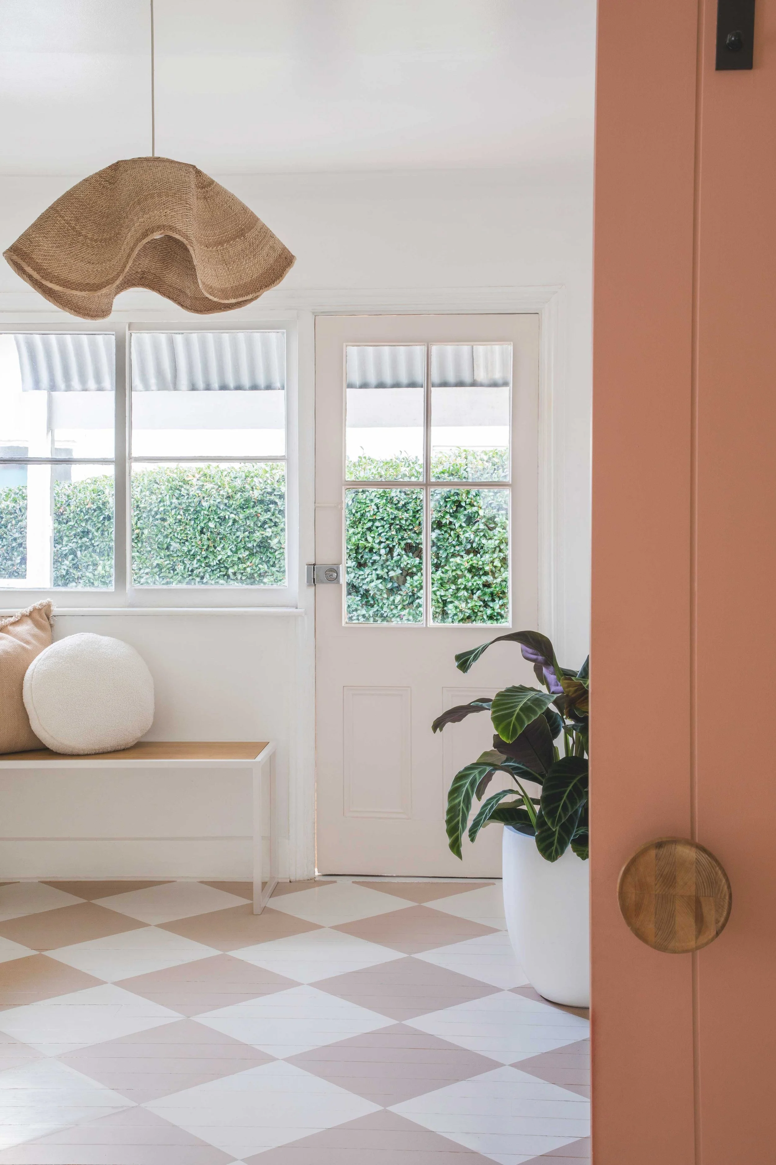 Rear entrance way chequered floor white bench seat pendant light NSW South Coast