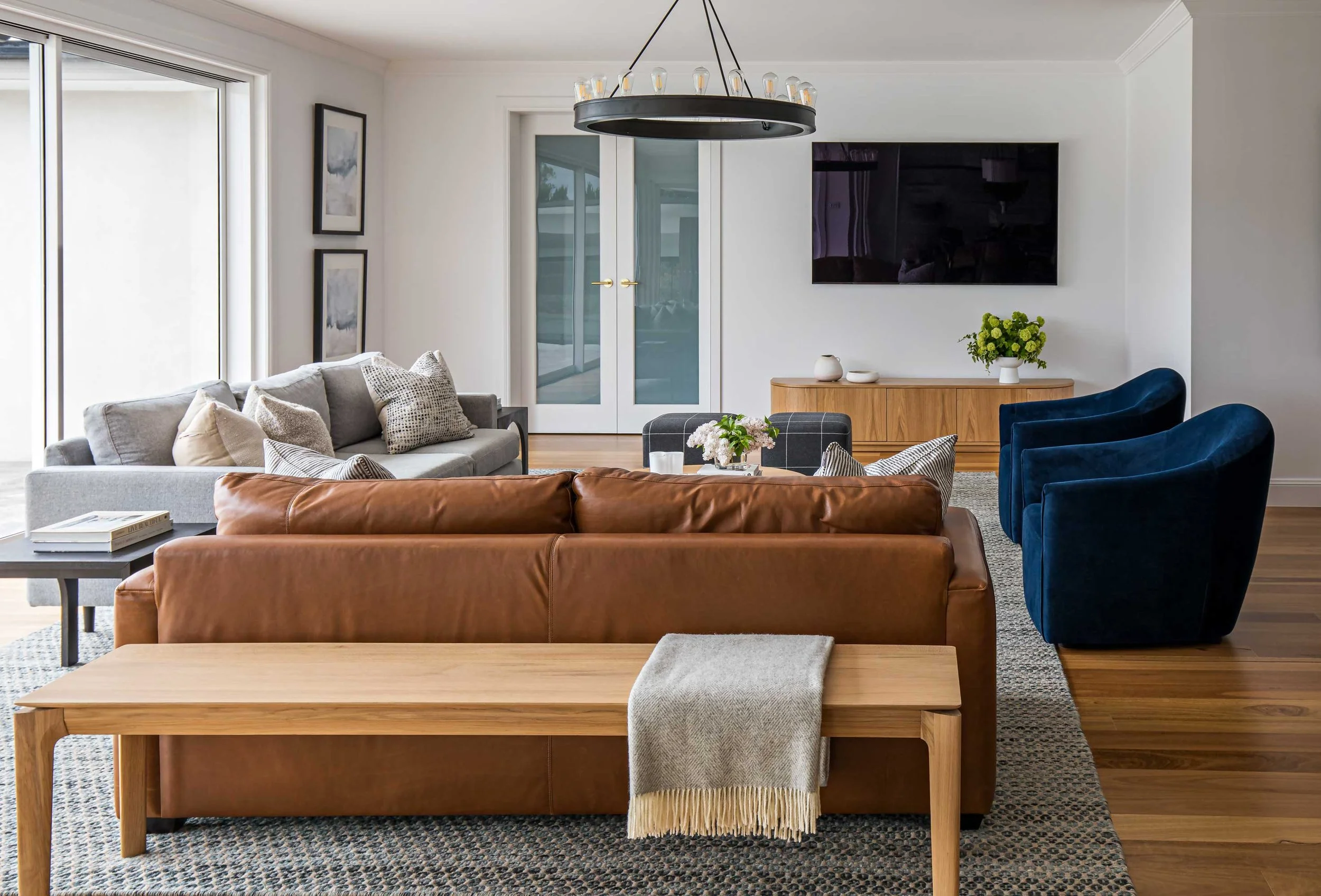 Modern eclectic Sydney living room chandelier wall tv French doors