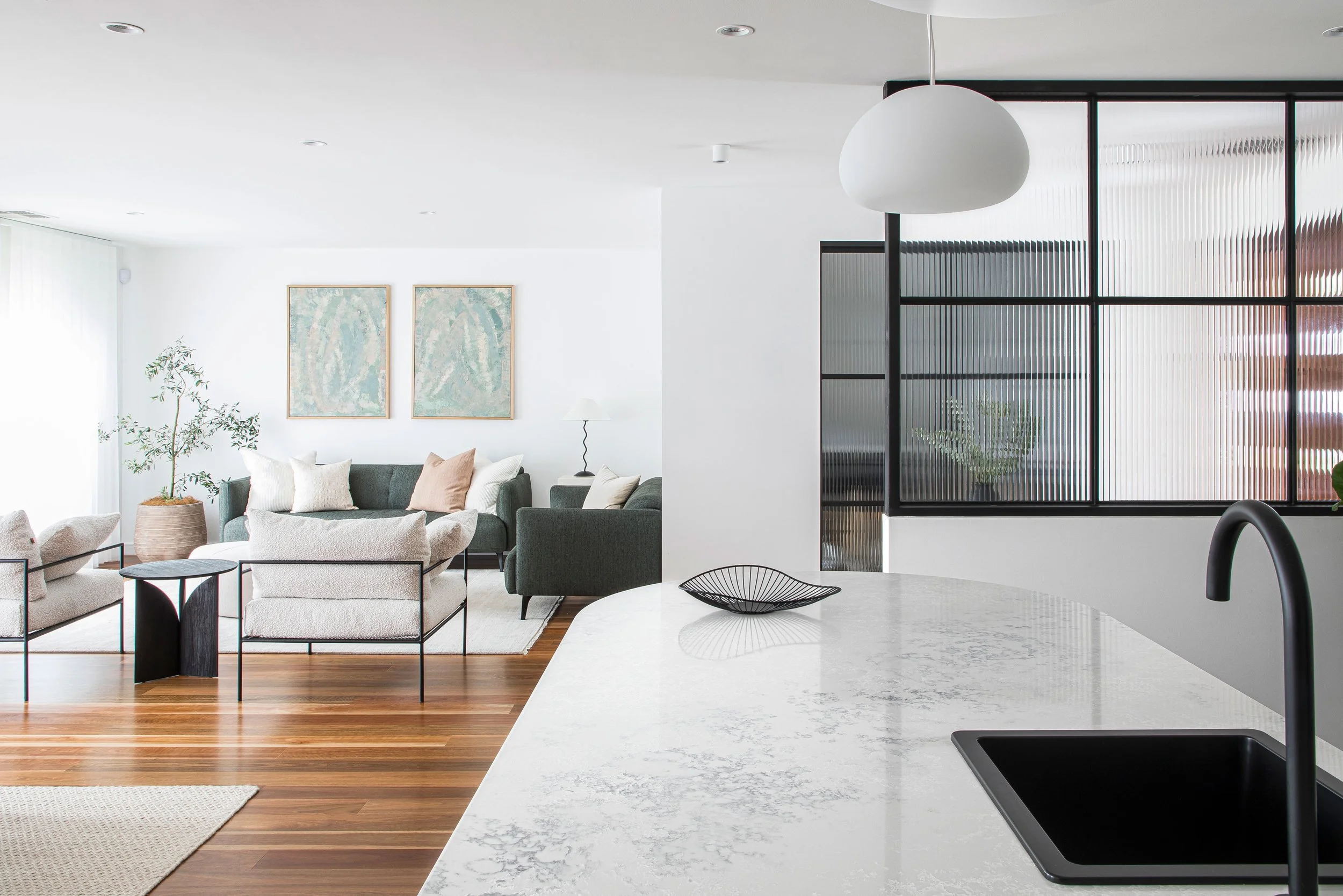Sydney modern open kitchen living marble island top black sink taps floorboards