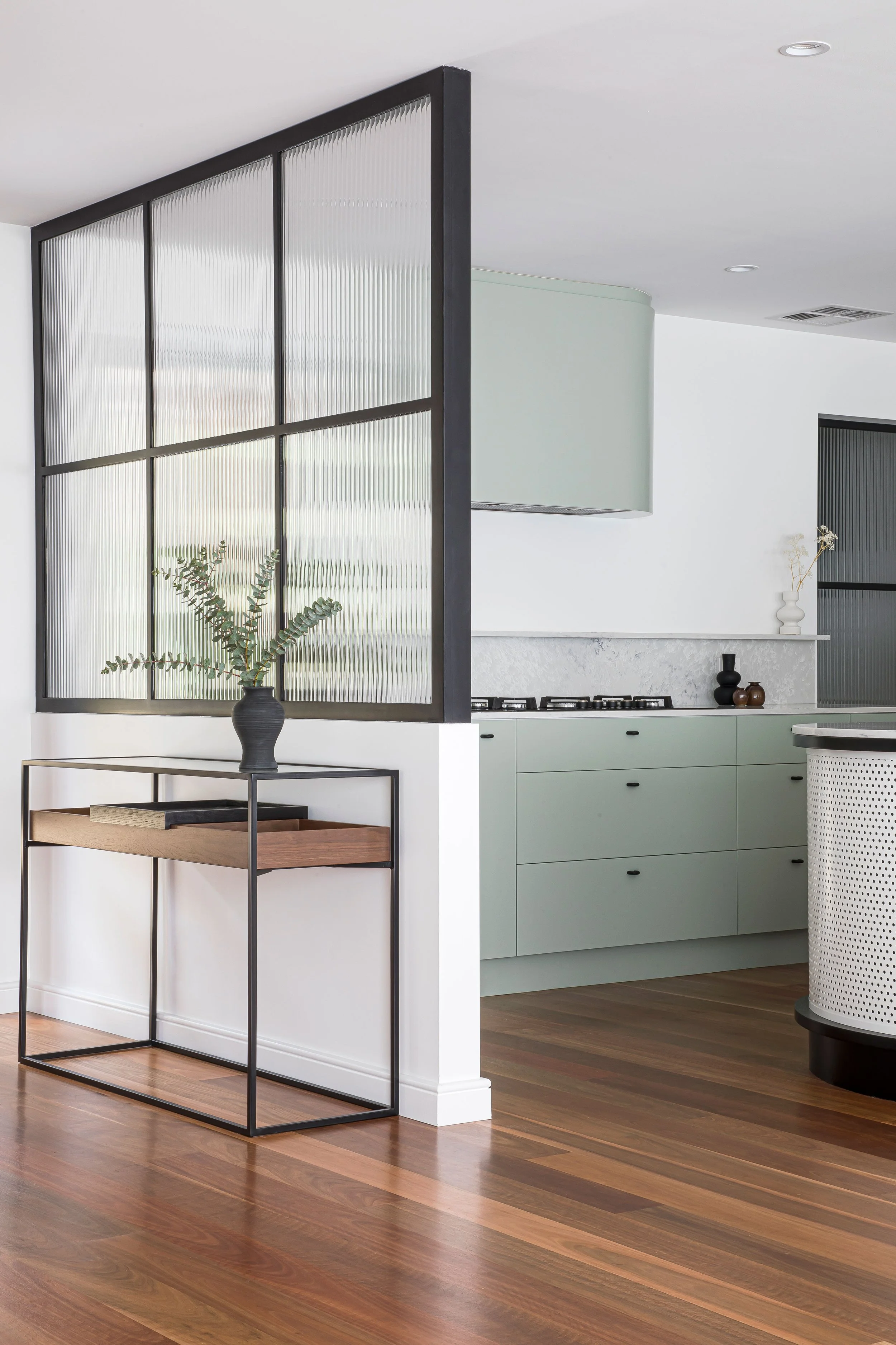 Modern Sydney Kitchen polished timber floors white walls frosted glass partition wall