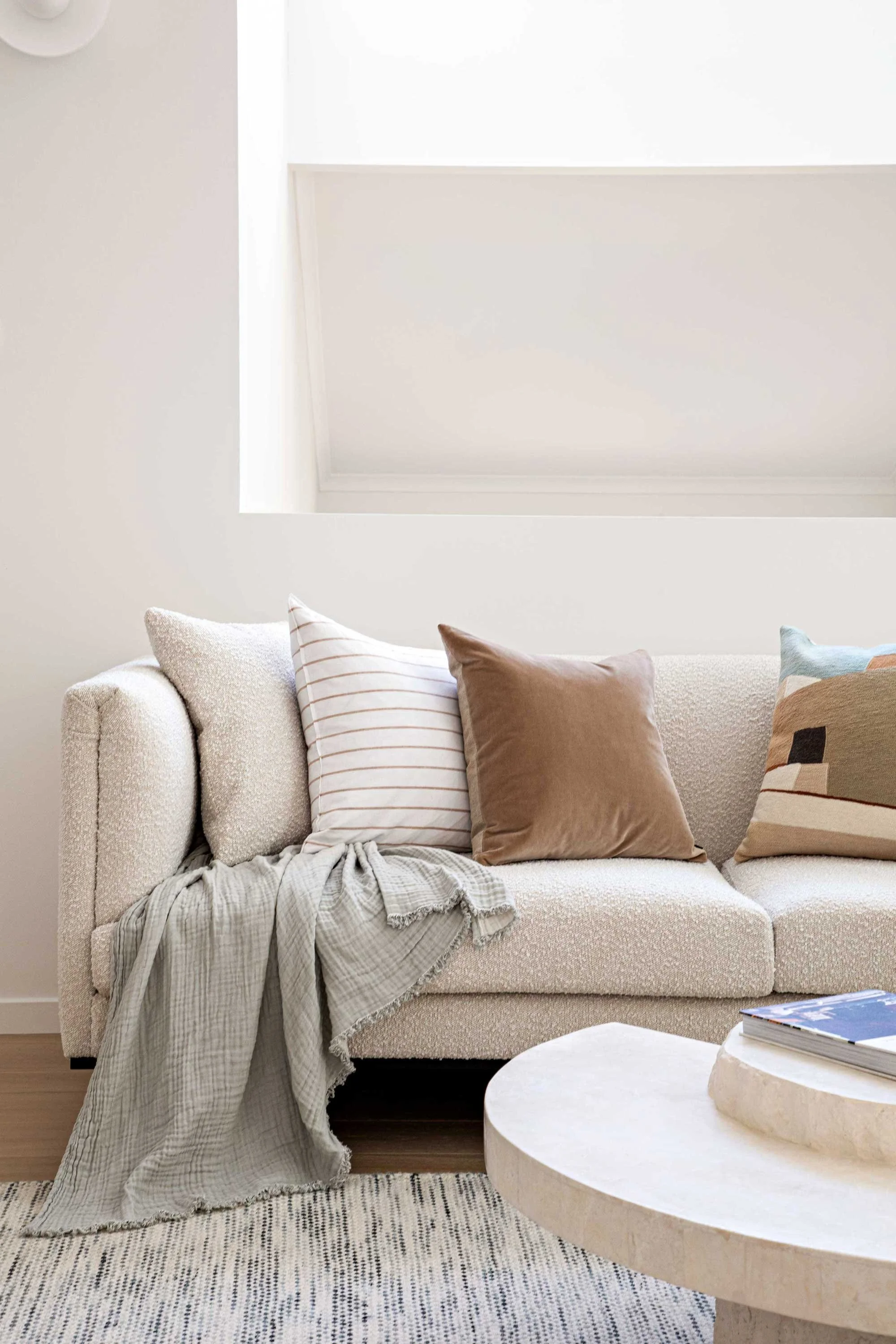NSW South Coast Interior styled living room  round coffee table throw rug cushions