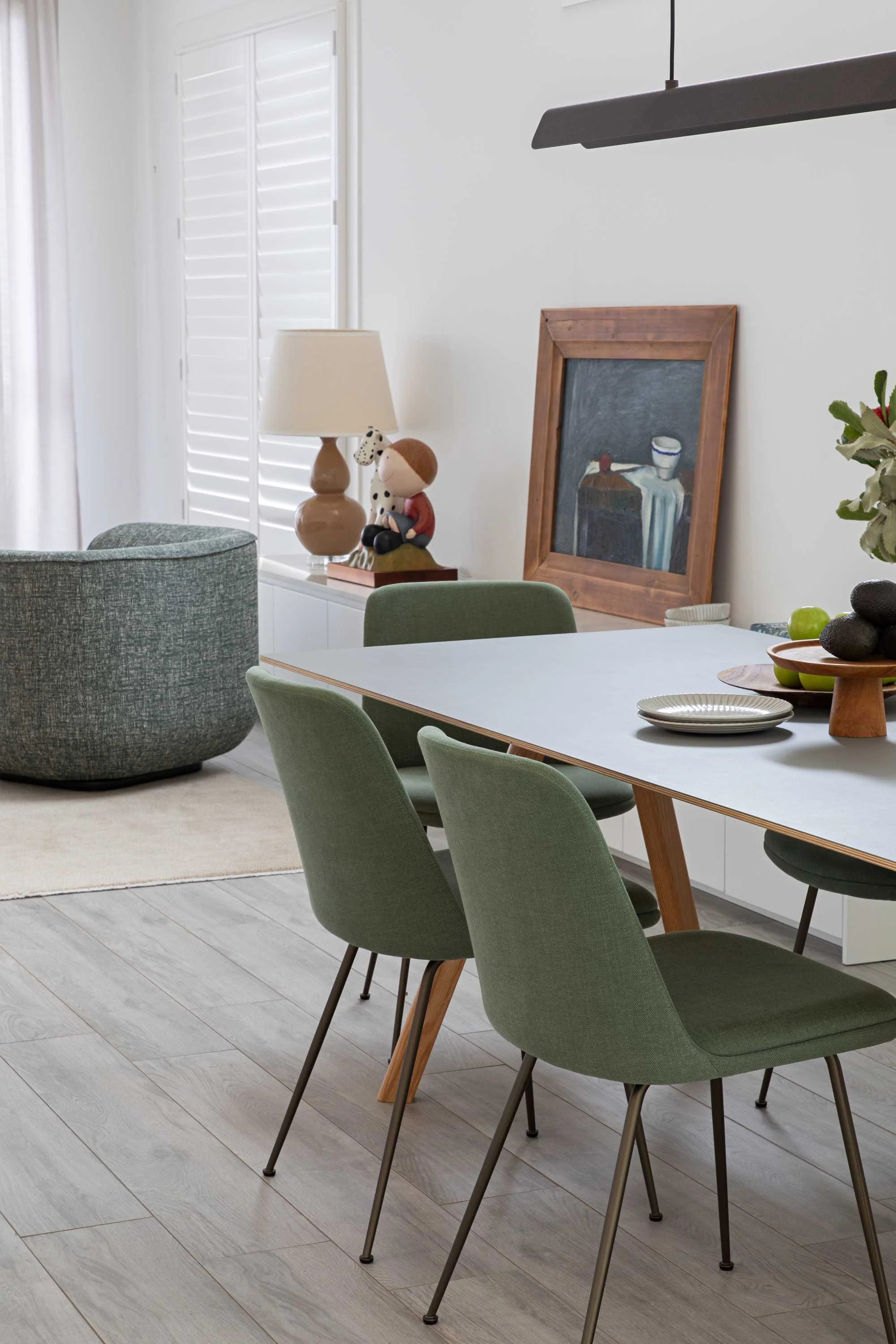 Sydney designer modern dining setting light painting against wall