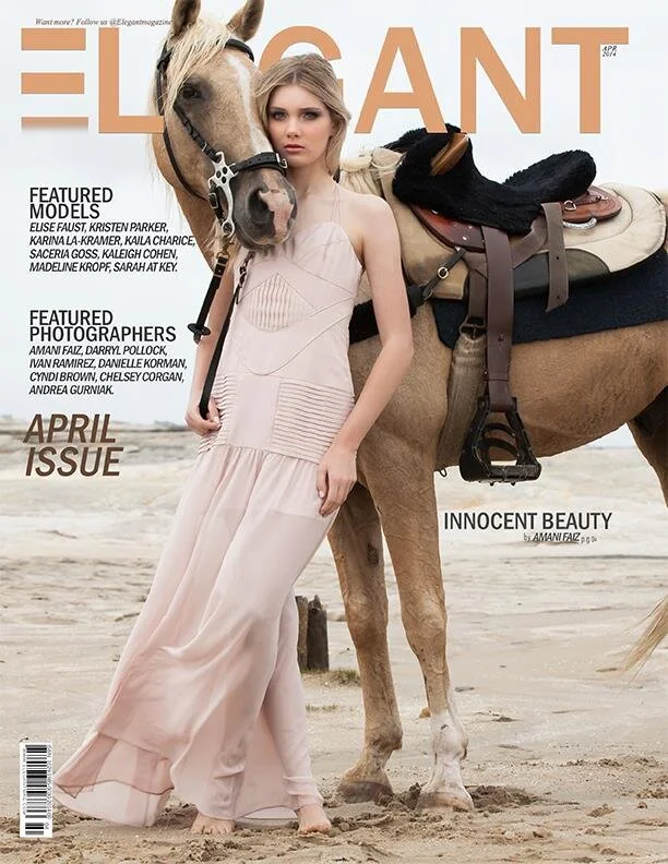 A young woman in a light pink flowing dress standing on a beach beside a horse with a saddle and bridle, looking directly at the camera.
