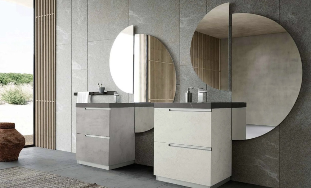 Modern bathroom with two sinks, large round mirrors, and a view of an outdoor landscape.