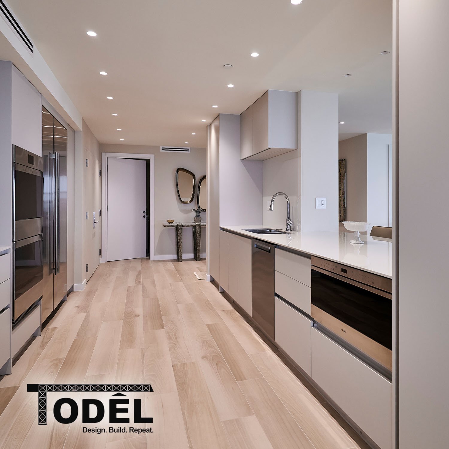 Modern kitchen remodeling with clean cabinetry, appliances, countertops, natural lighting