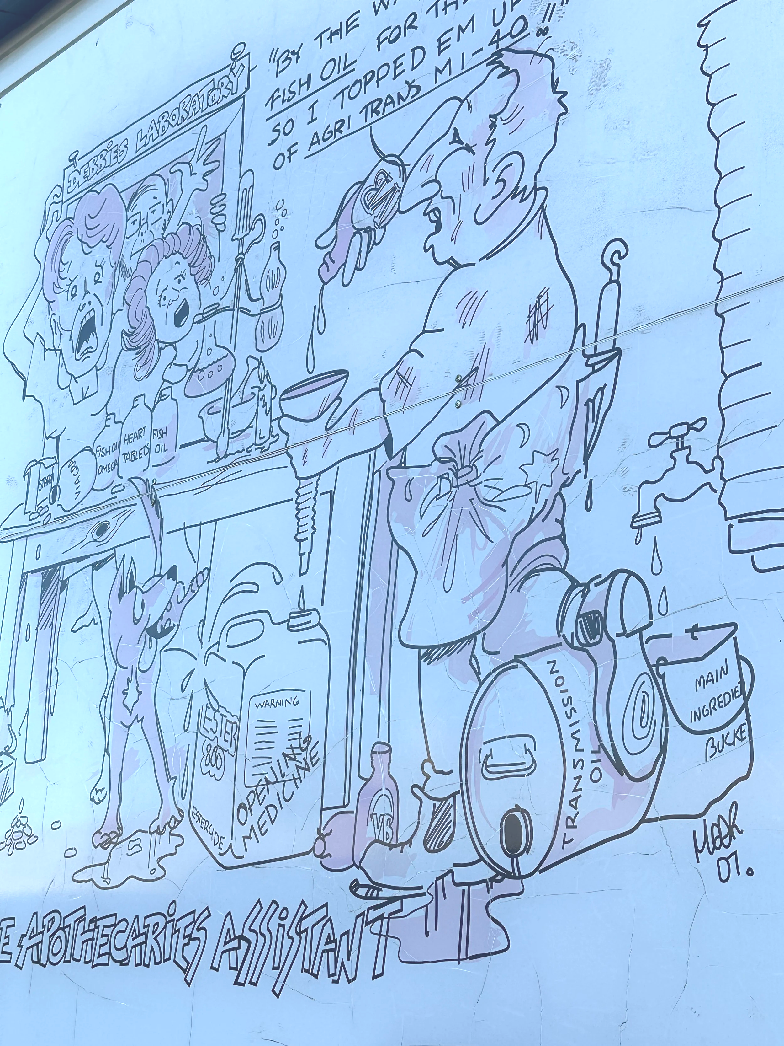 A cartoon drawing of a scientist in a cluttered laboratory with various bottles and equipment, showing exaggerated expressions. The scene includes a sign 'Debbie's Laboratory', and the scientist appears to be injured with a bandage on his head. There are labels like 'Transfer Oil', 'Main Ingredient Bucket', and a warning sign indicating 'Operation Medical' and 'Warning'. The drawing style is humorous and exaggerated, with expressive faces and dynamic lines.