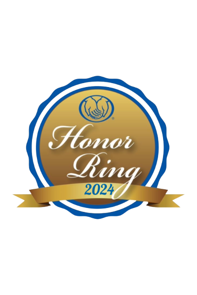 Honor Ring 2024 award badge with gold and blue design, featuring a handshake icon at the top and a gold ribbon at the bottom displaying the year.