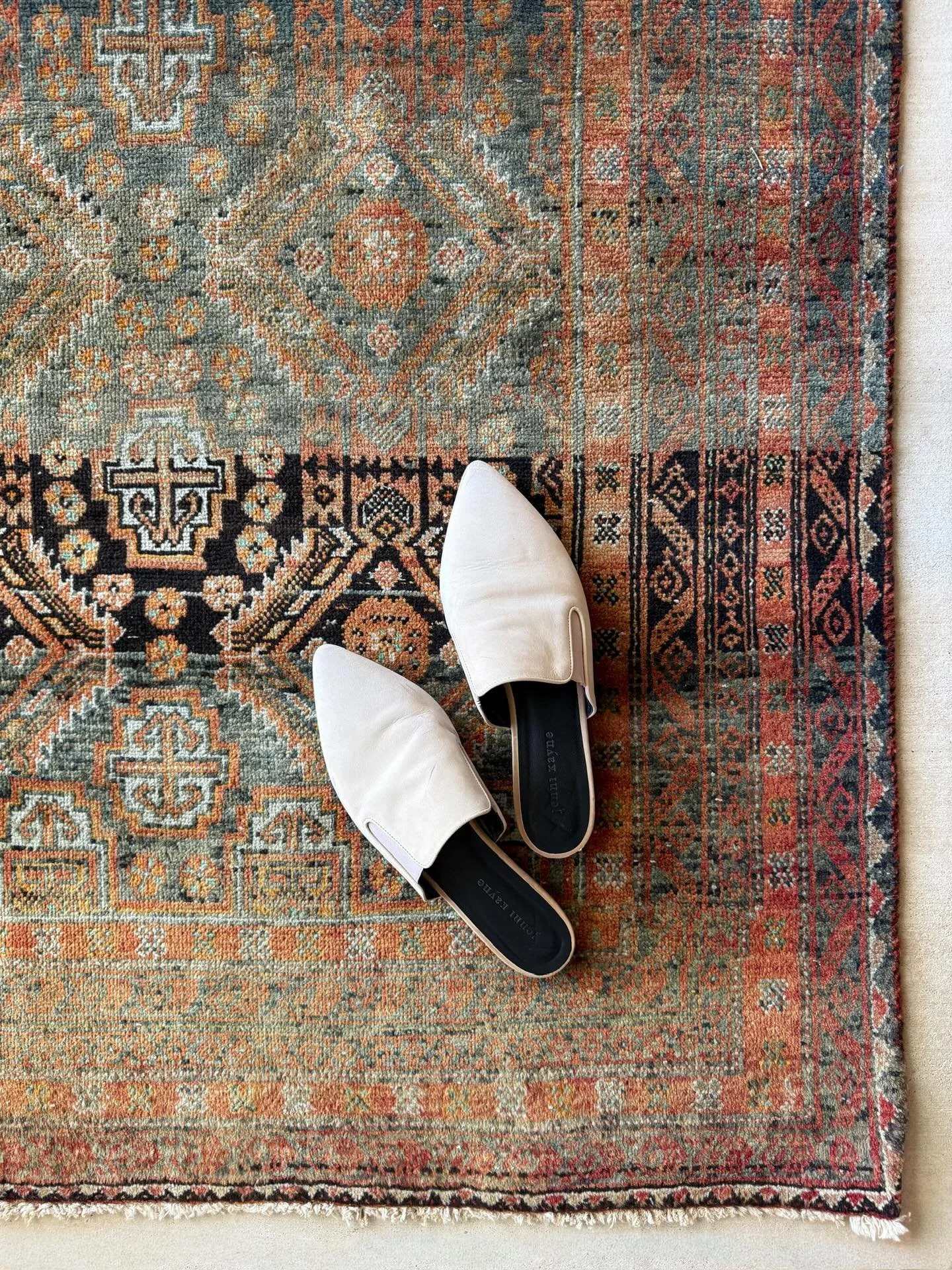 Some rugs shout. This one simmers.
Charcoal ground. Diamond medallions. Warm tallow and clove tones layered like spice in cast iron. 

Tallow Clove | 3&rsquo;5 x 6&rsquo;3