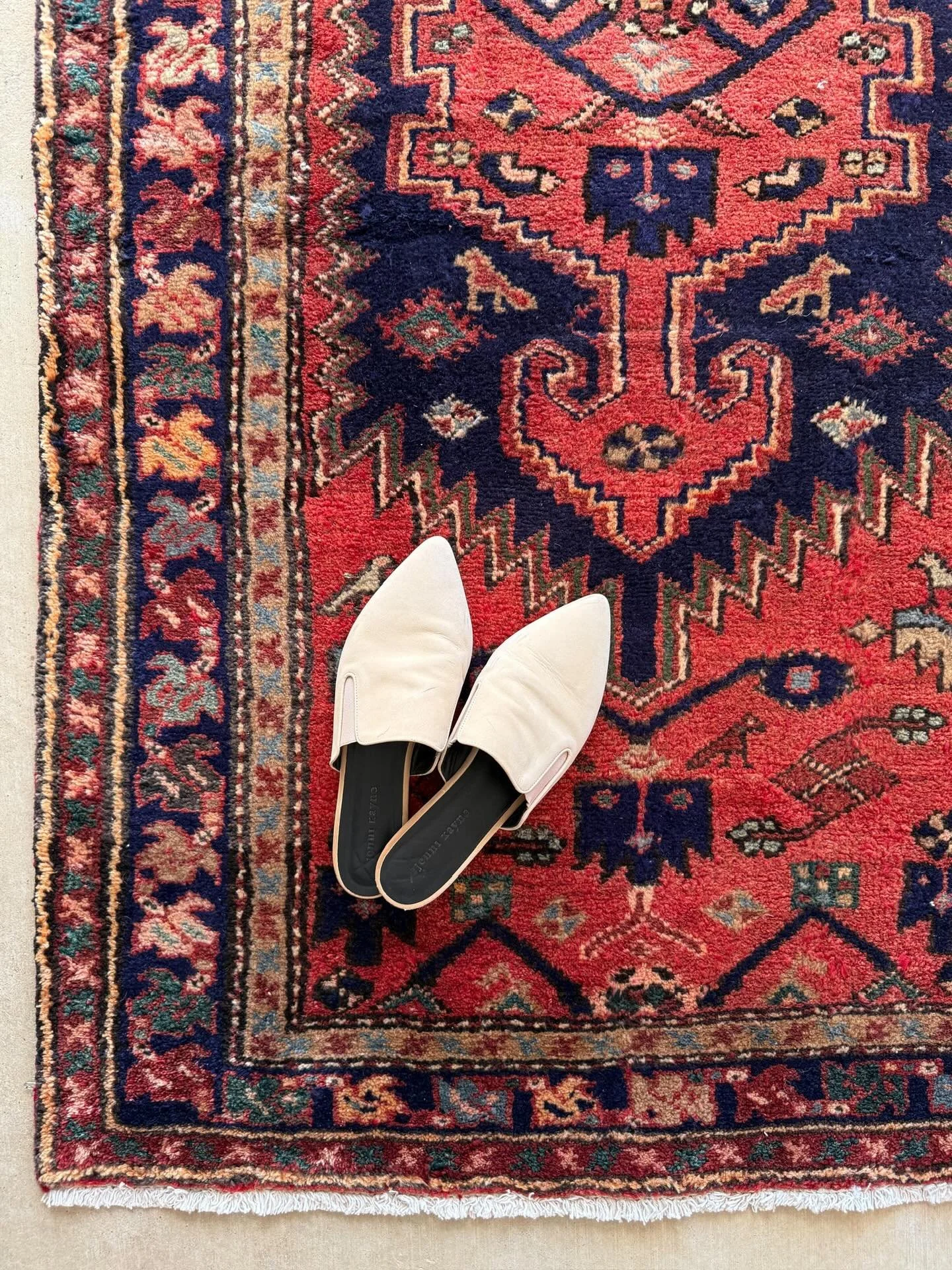 Wildheart Red is bold in all the right ways with sun-warmed crimson, midnight blues, and a stepped medallion that rises through the center like a flame.

Look closely and you&rsquo;ll find the tiny bird and animal motifs tucked throughout that are pr