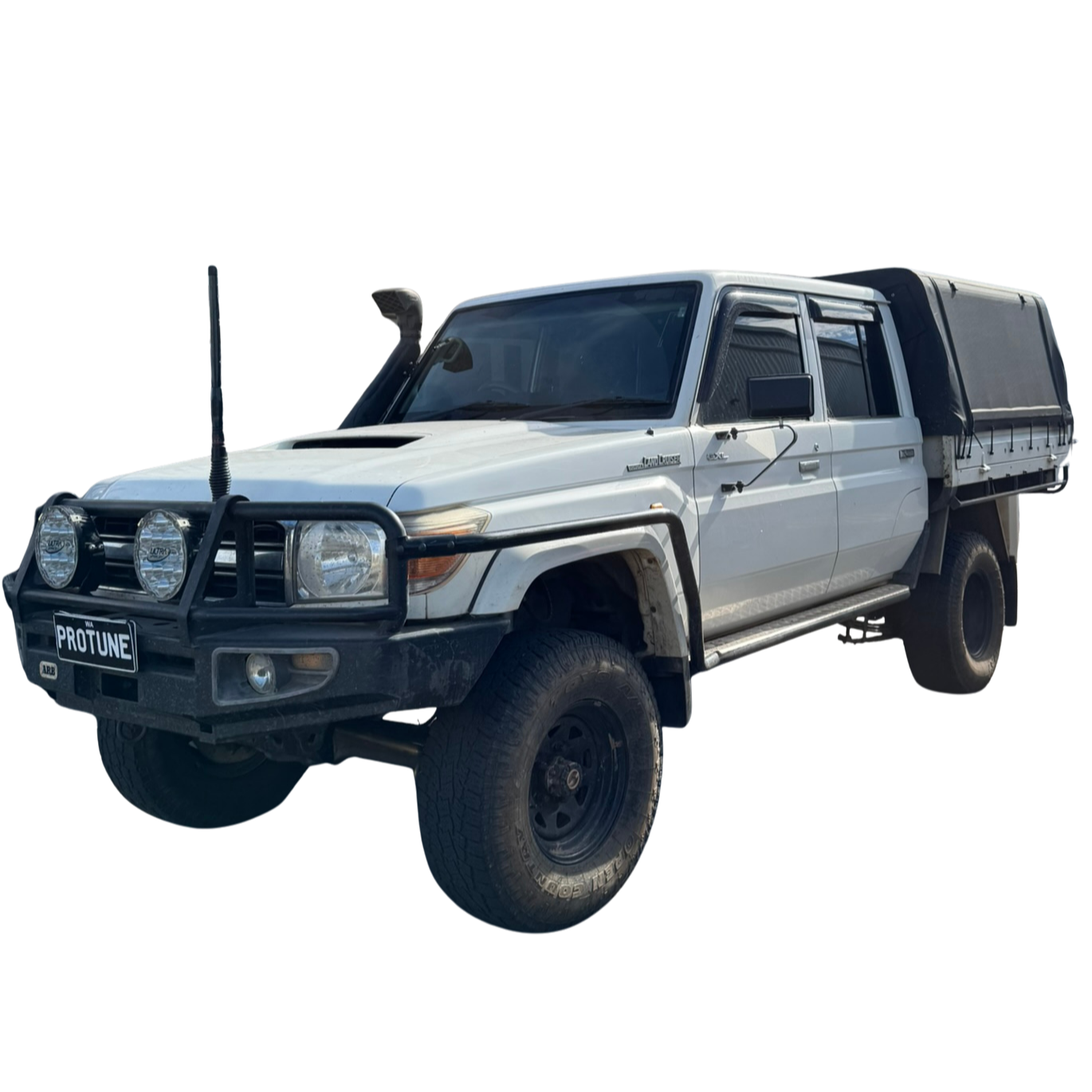 A white off-road Toyota 4WD with a black front bumper guard, mounted on the bumper are two large fog lights and a license plate reading 'PROTUNE', parked on a plain surface.