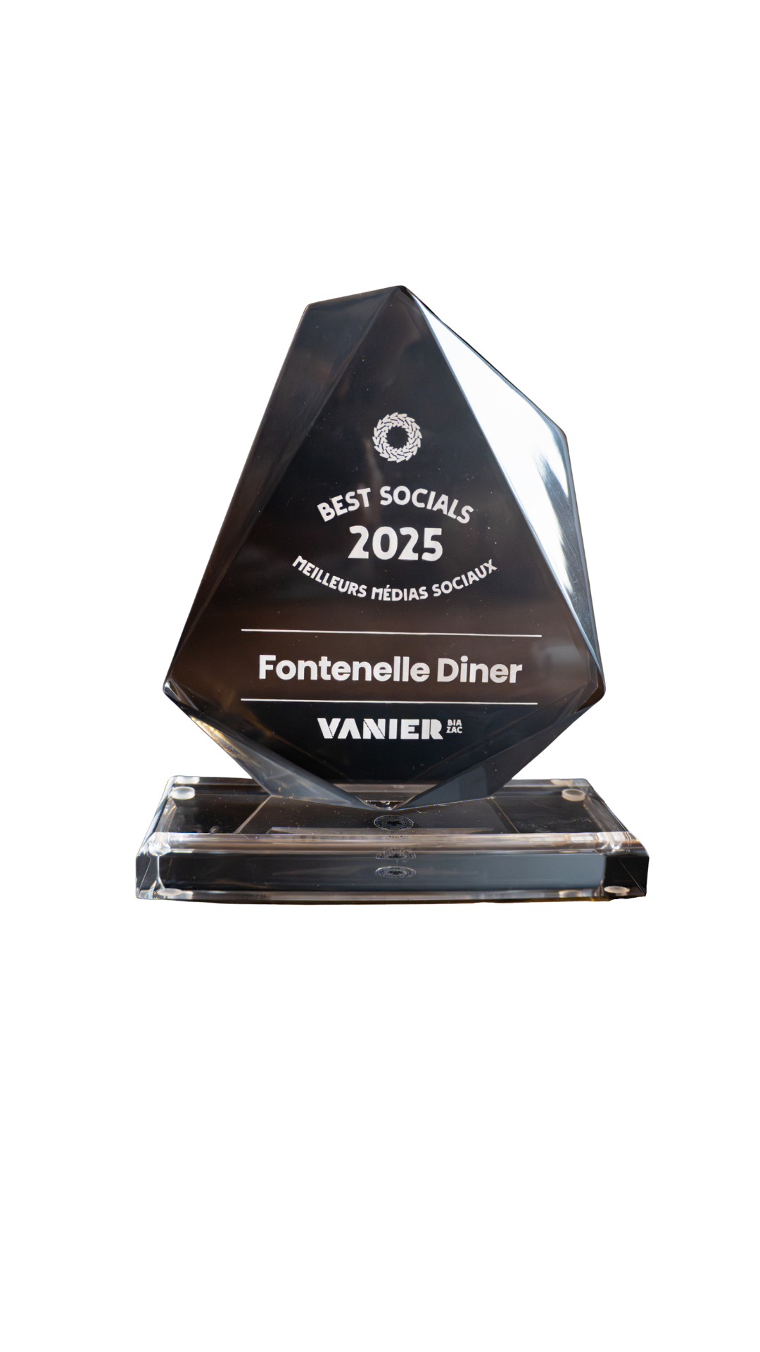 Glass award trophy with engraved text recognizing Fontenelle Diner as a top social media presence in 2025, presented by Vanier.