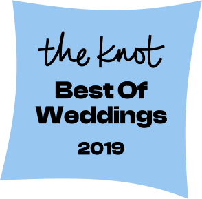 Blue ribbon with black and dark blue text reading 'the knot Best of Weddings 2019'