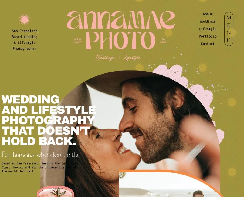 A website homepage for Annamae Photo, a wedding and lifestyle photographer, featuring a close-up photo of a smiling couple touching foreheads, with a green background and pink floral accents.