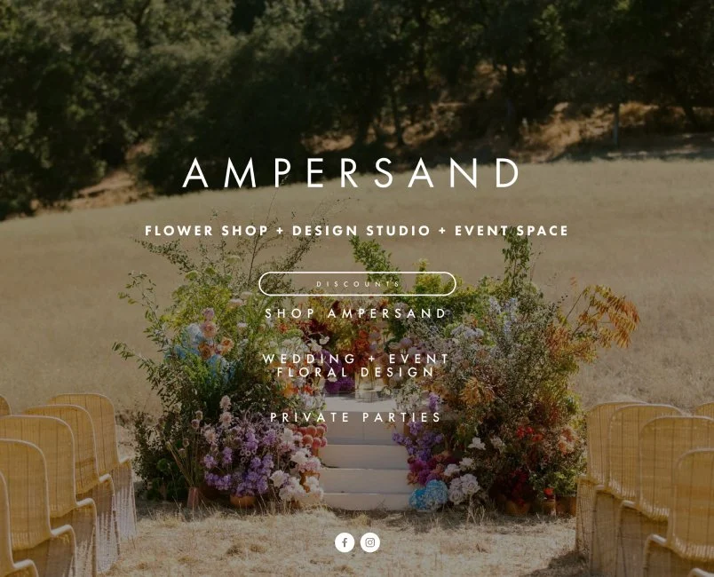 Website homepage for Ampersand, a flower shop, design studio, and event space, showing floral arrangements and outdoor seating in a field.
