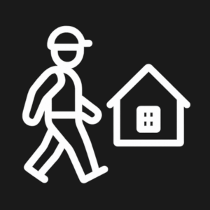 Simple white icon of a person walking with a hat and a bag, next to a house, on a black background.