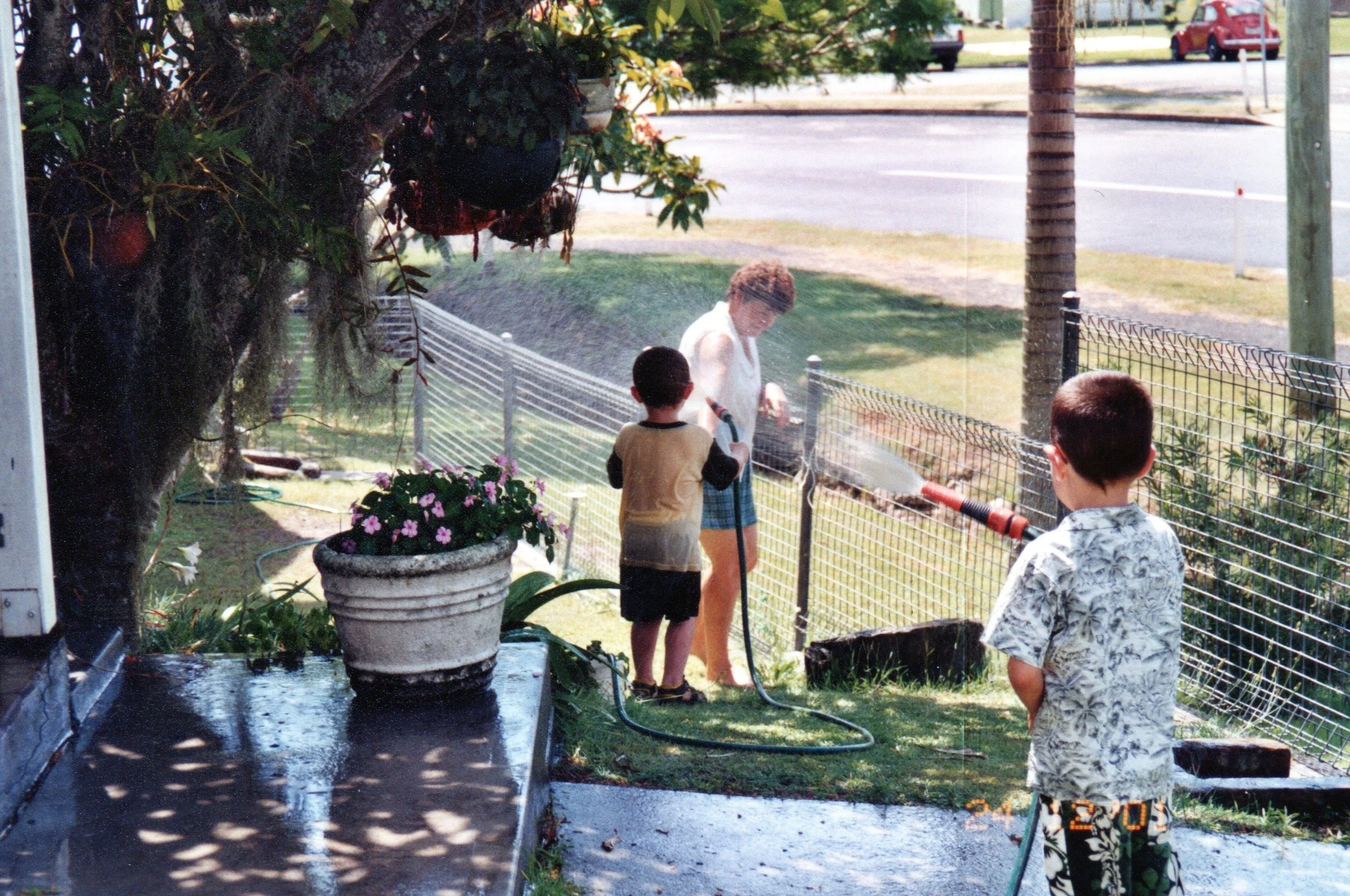 Mum%2C+Matthew%2C+Brendan+-+Water+fight+24+Dec+2001.jpg