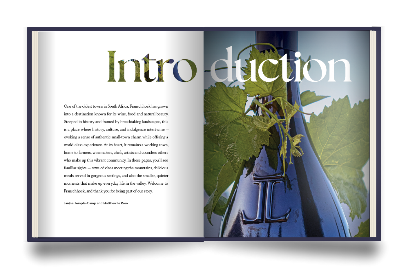 The Franschhoek Experience Book spread with an introduction to Franschhoek, South Africa, featuring a bottle of Cap Classique