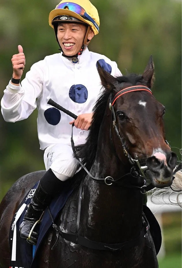 Golden Sixty with his jockey giving a triumphant thumbs‑up, capturing the champion’s trademark Hong Kong racing brilliance and post‑race celebration energy.