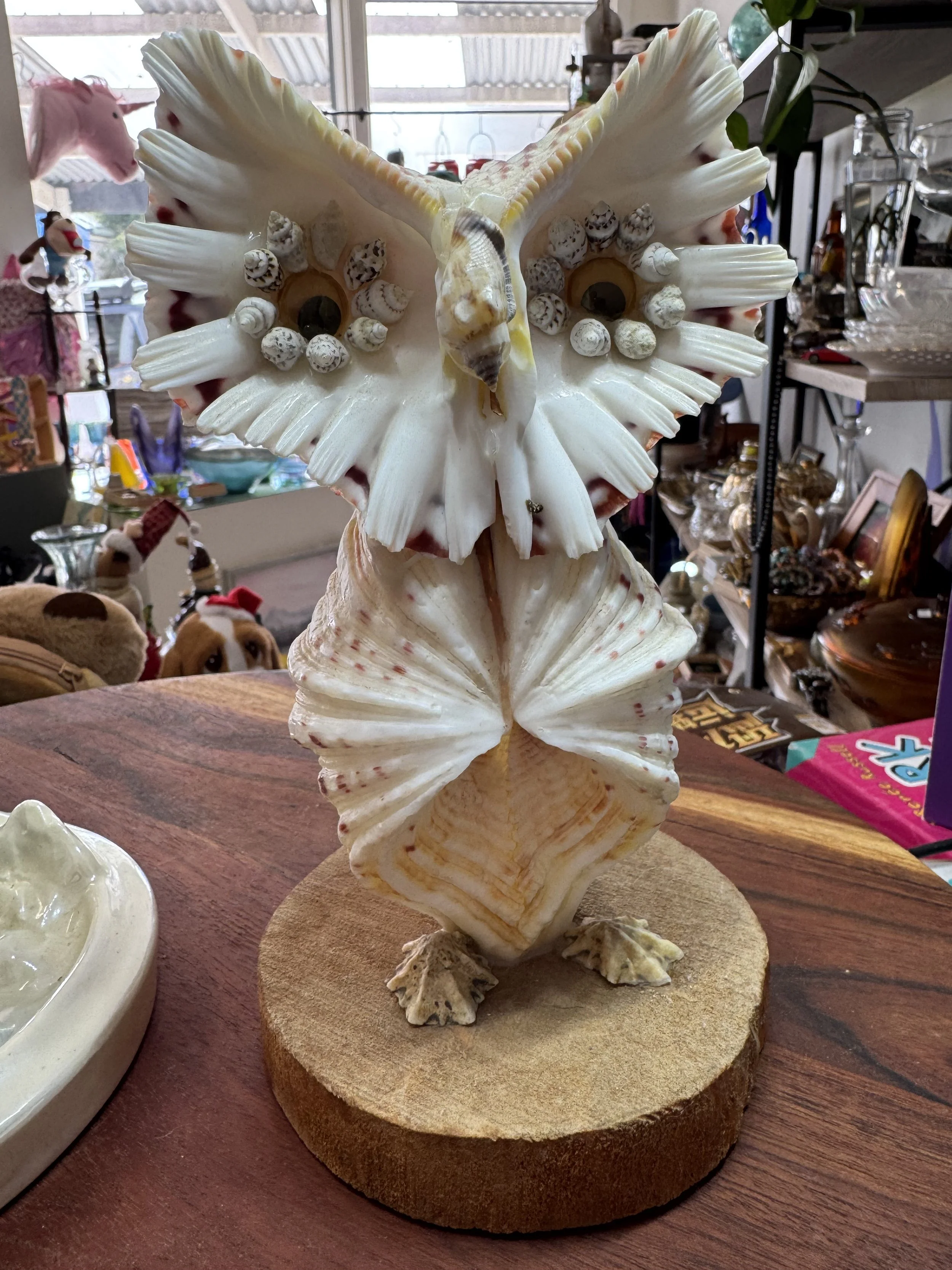 large vintage owl made of shells,