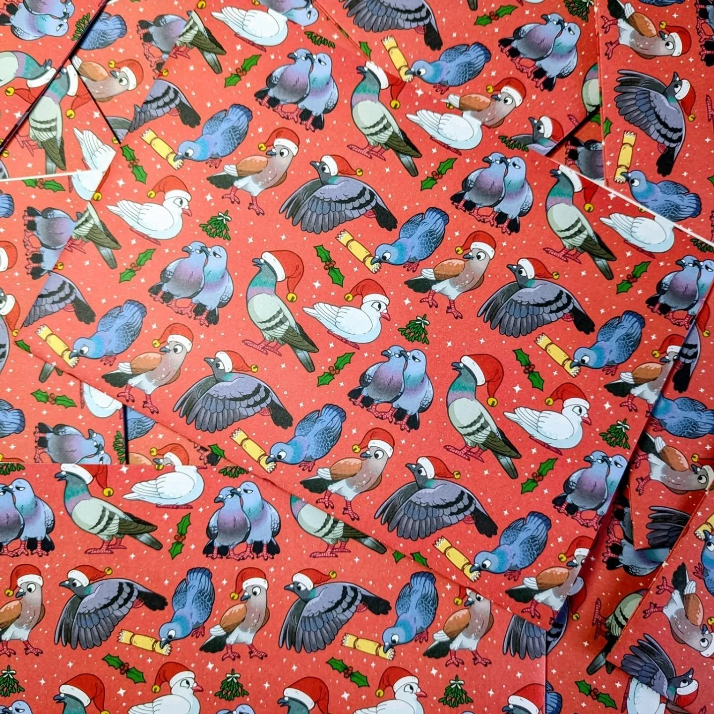 The pigeon wrapping paper is back in stock after selling out last year! You guys really love pigeons in hats.. 

Which is your favourite li'l festive pidge? I think mine is cracker-pigeon. Please won't someone help him pull his cracker? 😭 

You'll f
