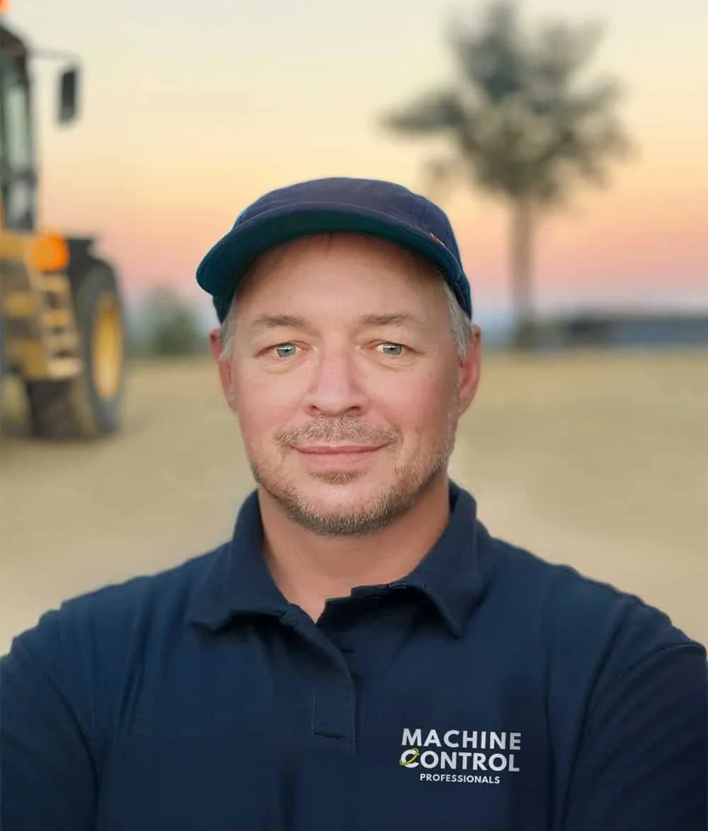 Scot Townsend - the founder of Machine Control Professionals - stands on a construction site where he is providing machine control support.