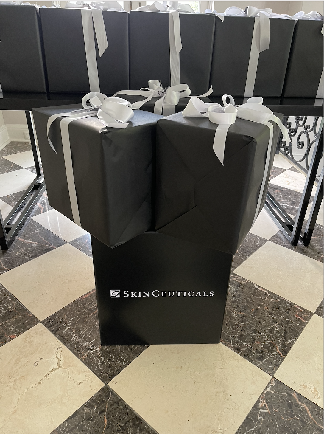 Black gift box wrapped with a white ribbon | Luxury Gift Wrapping & Custom Hampers