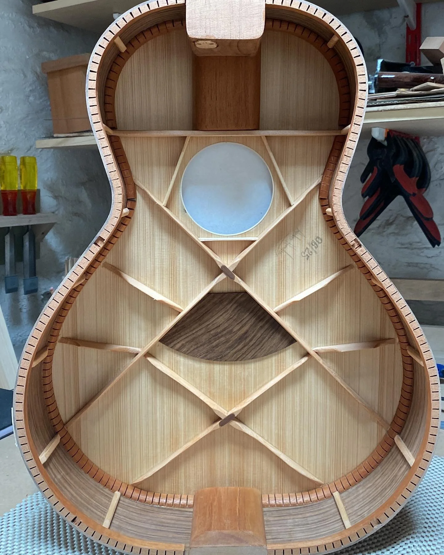 Shellacked interior, to seal the wood slowing the affects of humidity on the guitar.
