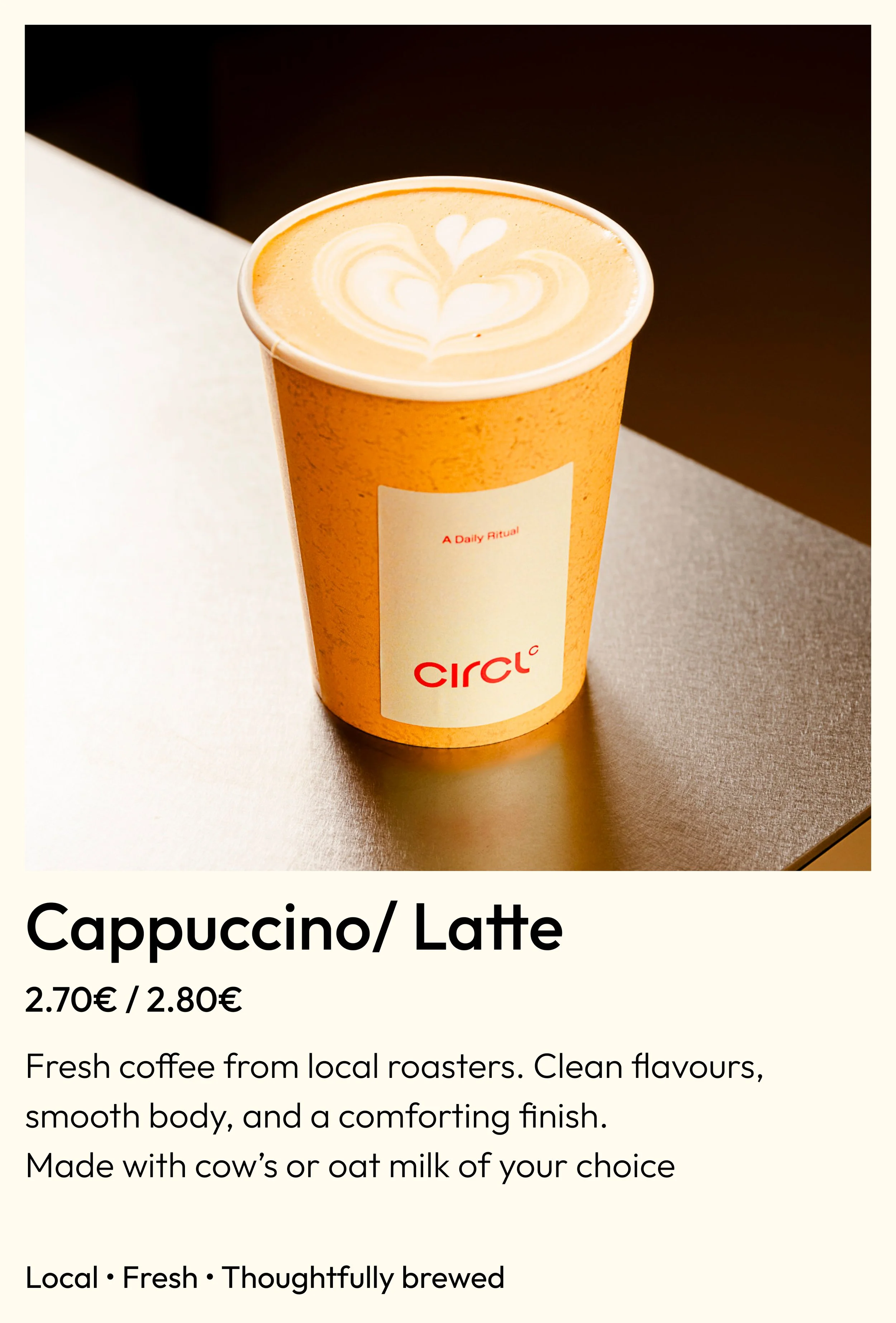 Hot latte with heart latte art in a Circl cup, specialty coffee in Eixample, Barcelona