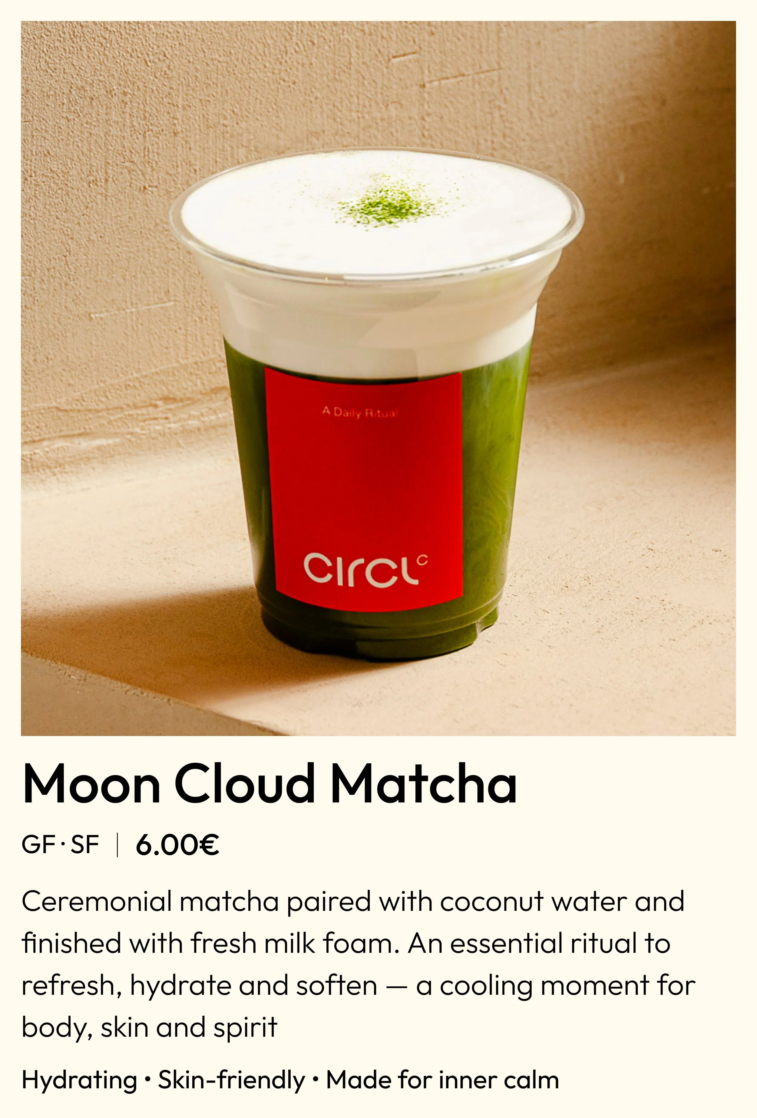 A green cup with a red label that reads 'Circle' contains a Moon Cloud Matcha drink with a frothy top and a green sprinkle.
