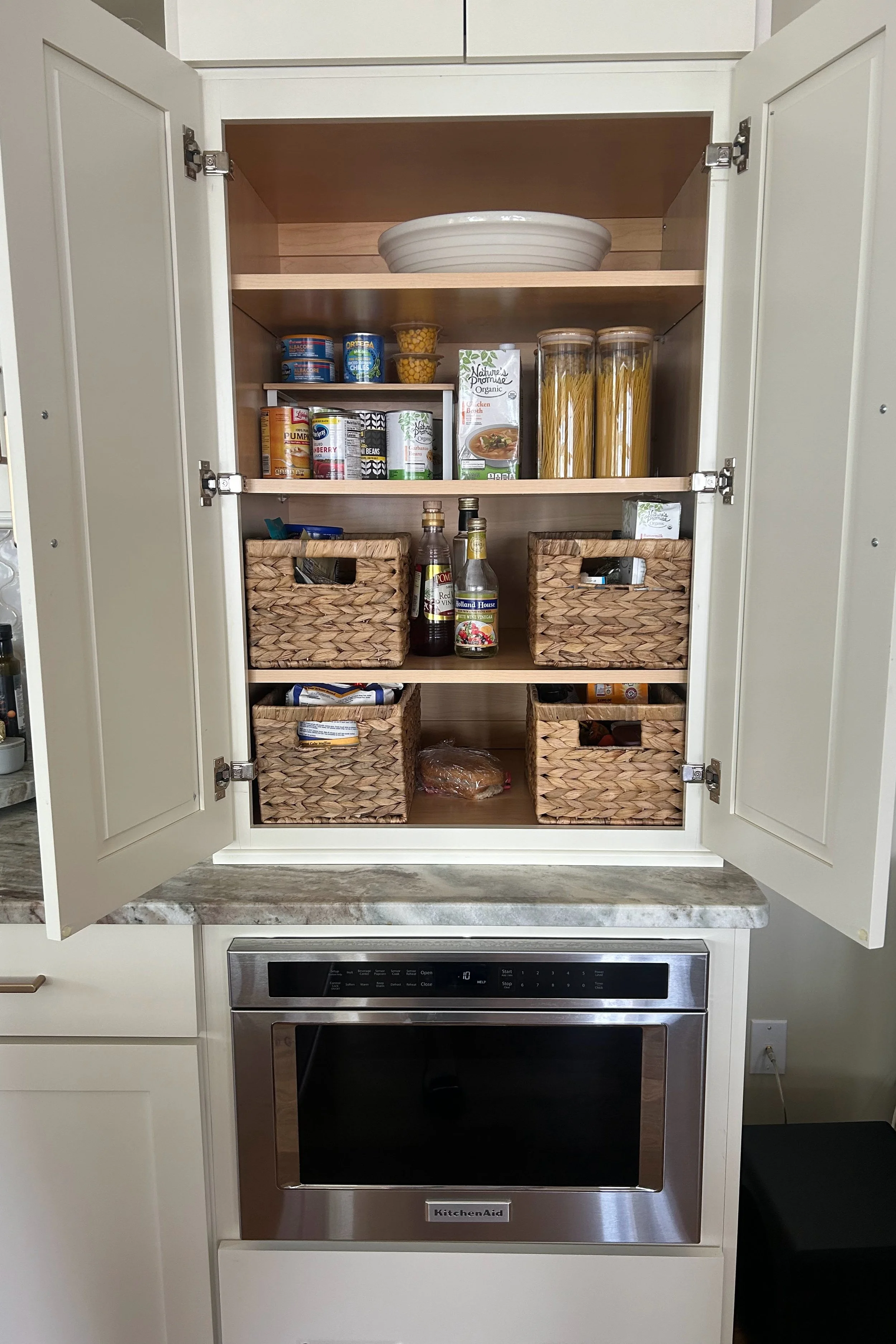 After: Added baskets, glass containers, & a shelf.